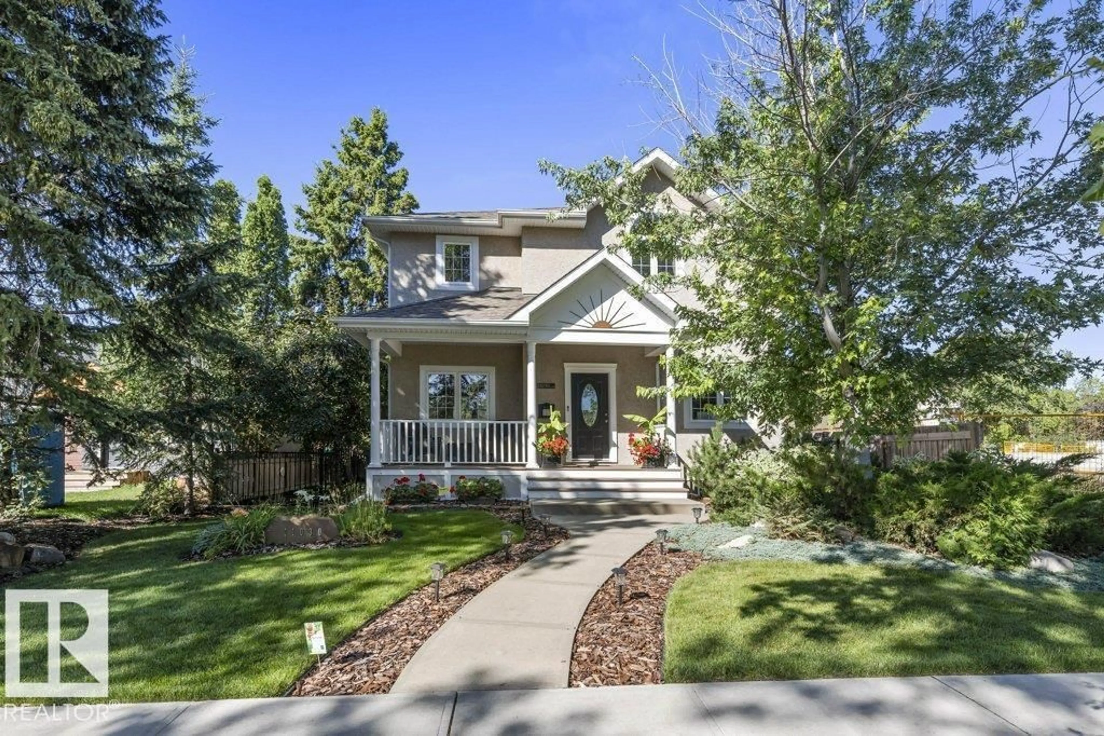 Home with vinyl exterior material, street for NW - 11030 122 ST, Edmonton Alberta T5M0B3