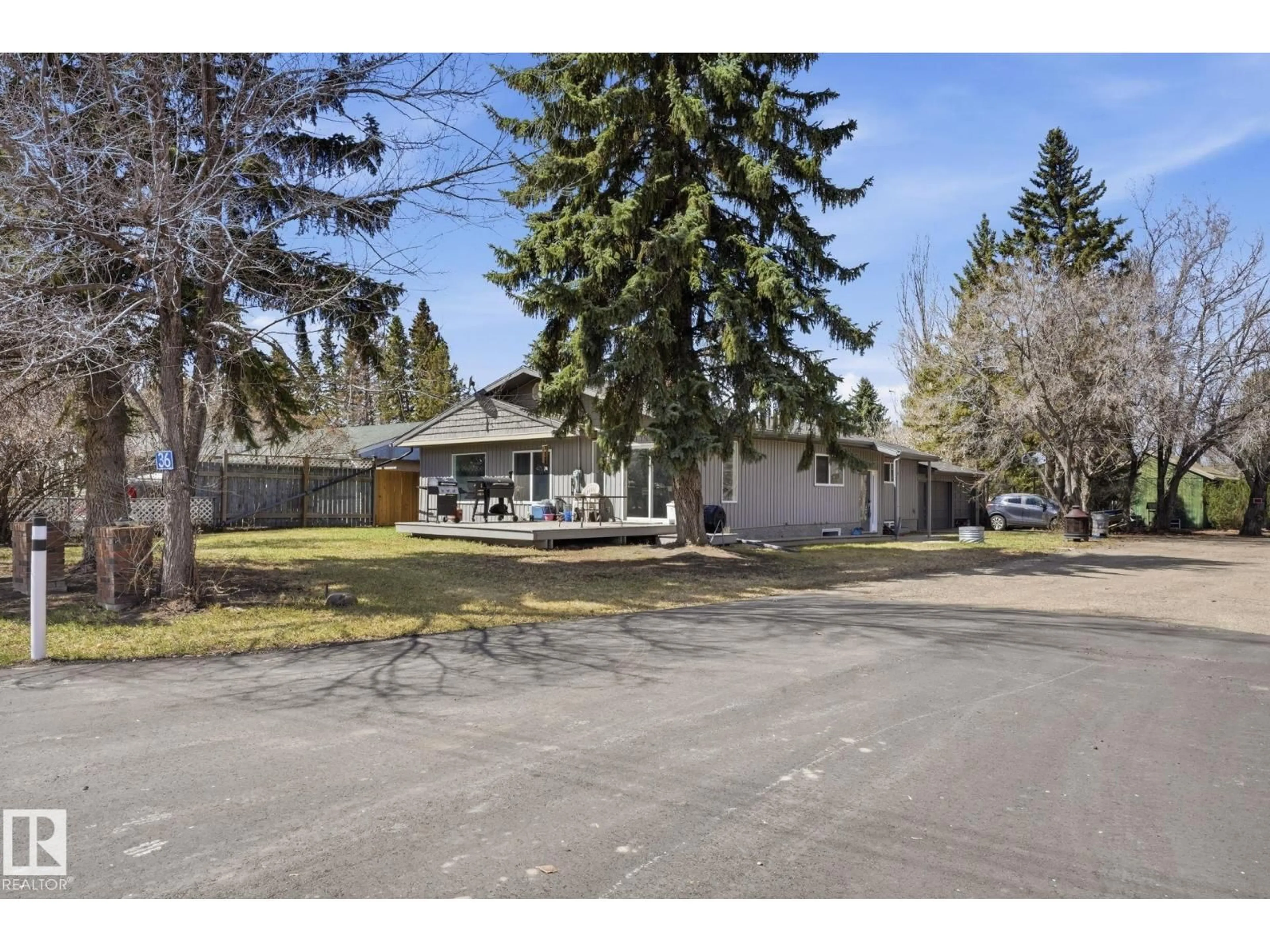 A pic from outside/outdoor area/front of a property/back of a property/a pic from drone, street for 55000 - 36 LAMOUREUX DR, Rural Sturgeon County Alberta T8L5A7