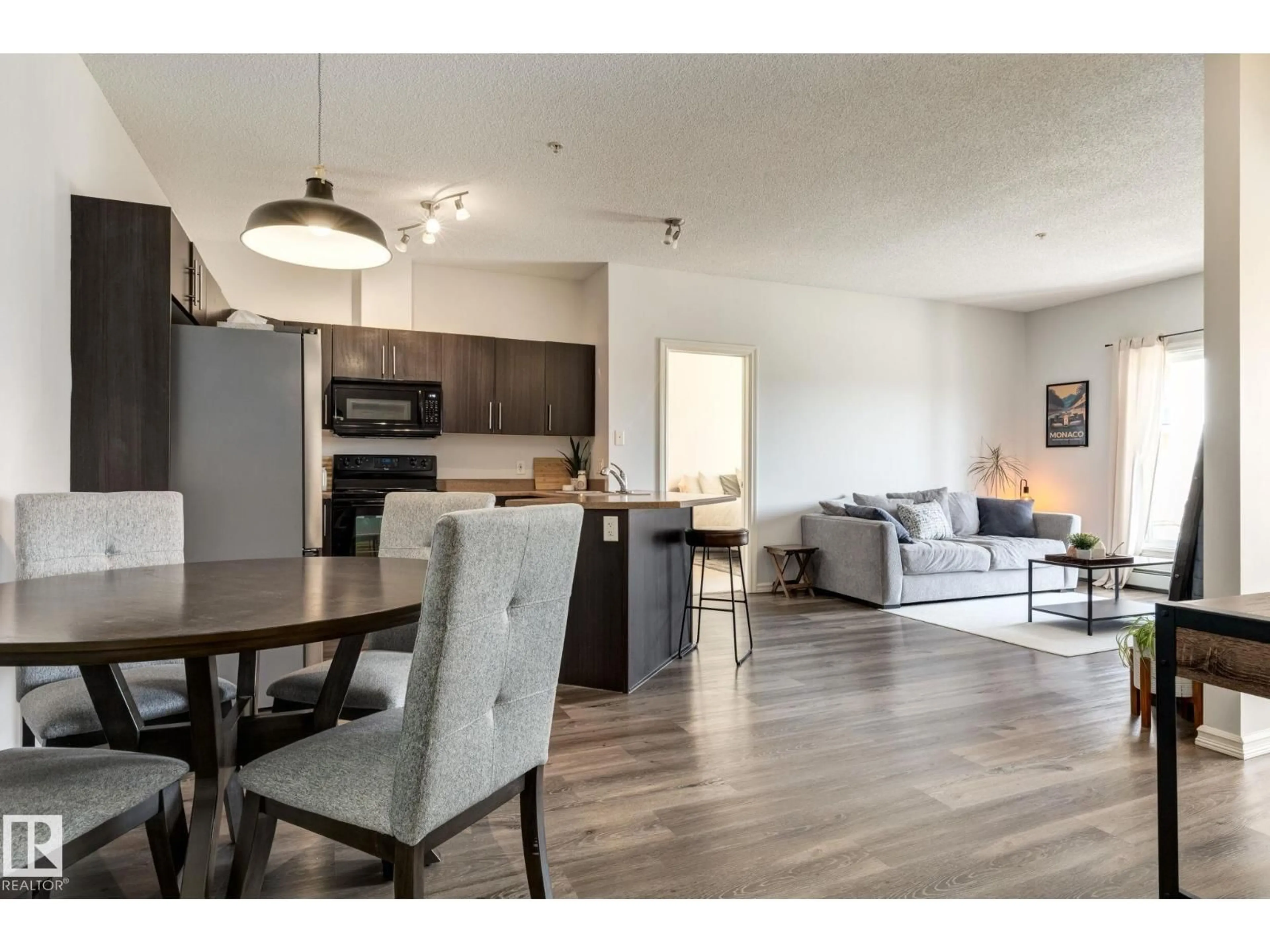 Open concept kitchen, wood/laminate floor for 263 - 235 MACEWAN RD, Edmonton Alberta T6W0C4
