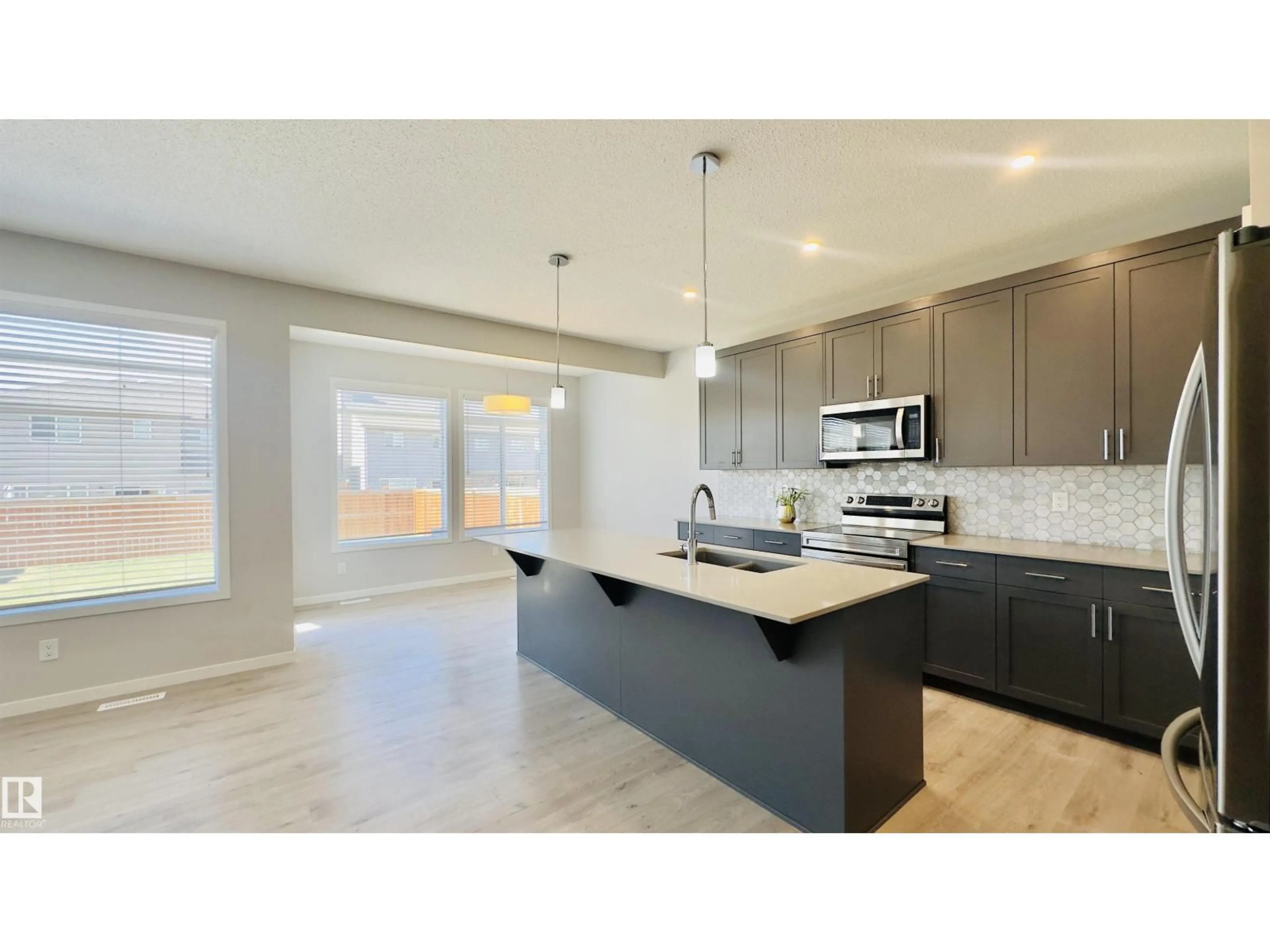 Open concept kitchen, ceramic/tile floor for 932 MCCONACHIE BLVD, Edmonton Alberta T5Y3X5