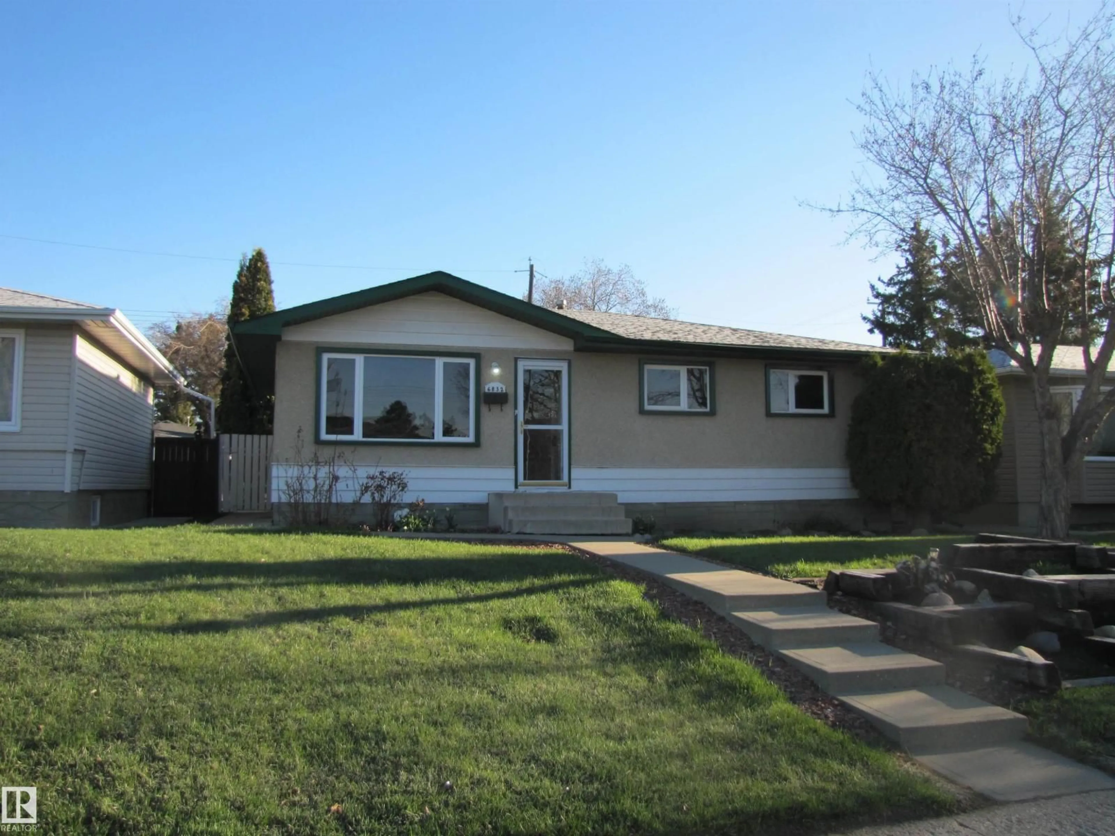 Home with vinyl exterior material, street for 6832 83 AV, Edmonton Alberta T6B0G5