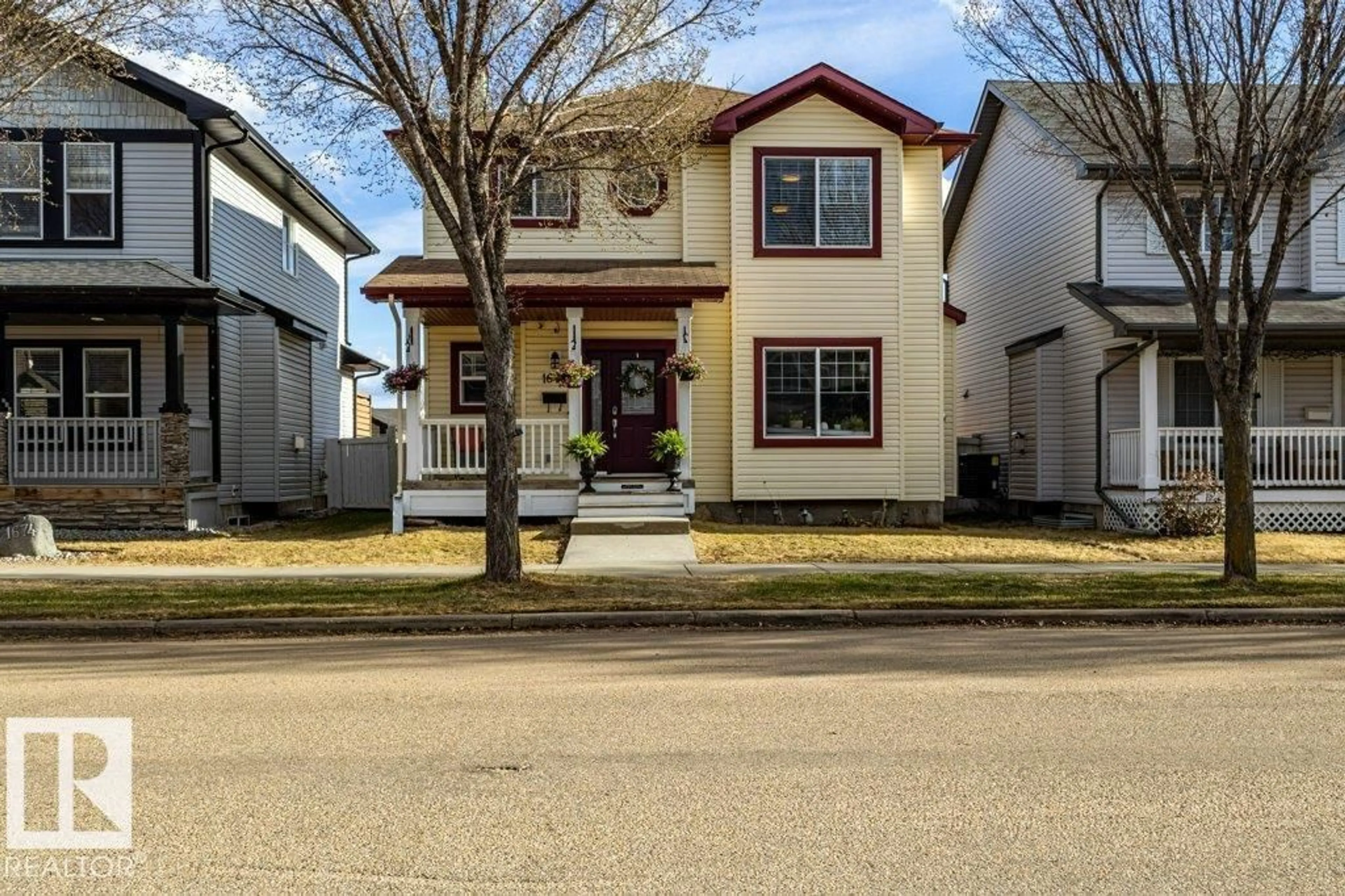 Home with vinyl exterior material, street for 1676 TOMLINSON CM, Edmonton Alberta T6R3J3