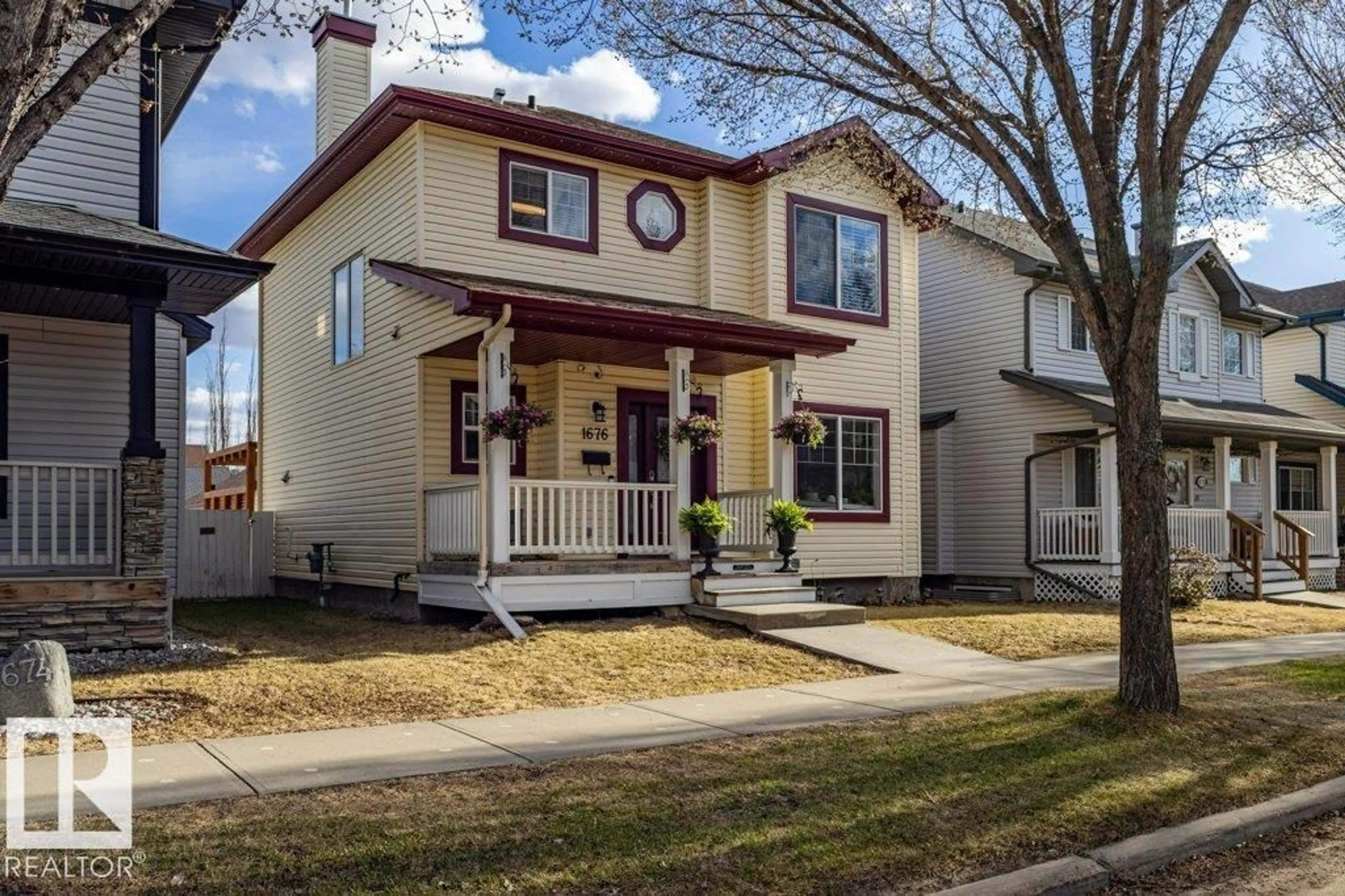 Home with vinyl exterior material, street for 1676 TOMLINSON CM, Edmonton Alberta T6R3J3