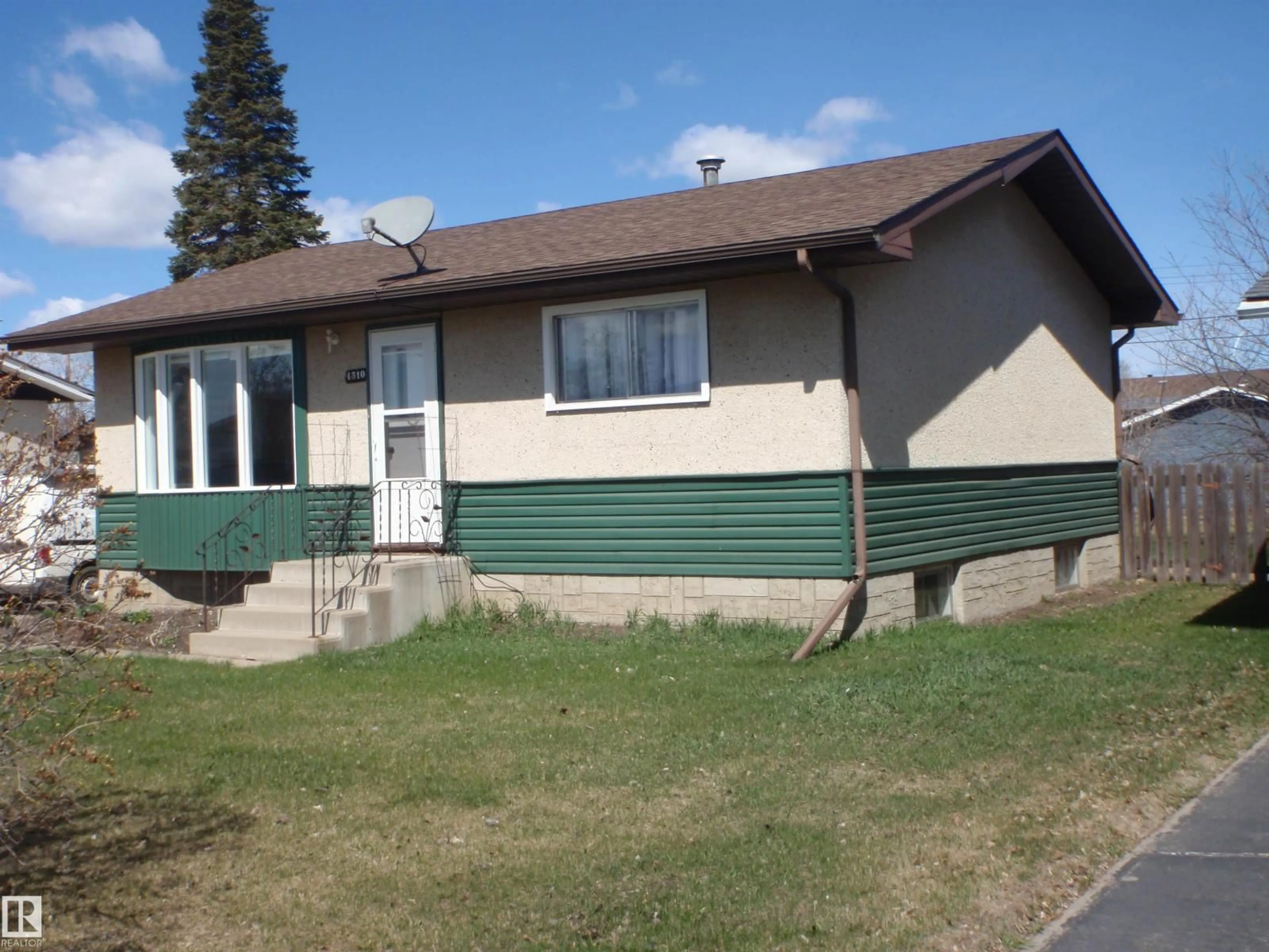 Home with vinyl exterior material, street for 4510 57 AV, Barrhead Alberta T7N1K2