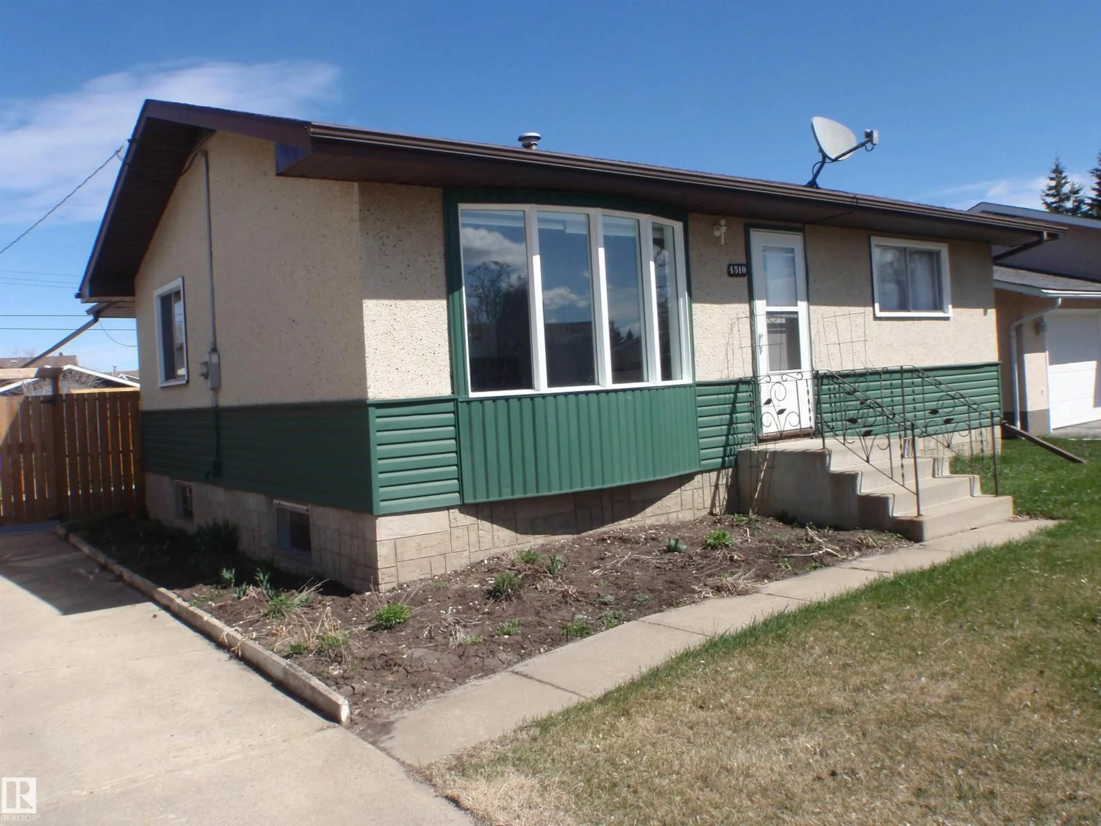 Home with vinyl exterior material, street for 4510 57 AV, Barrhead Alberta T7N1K2