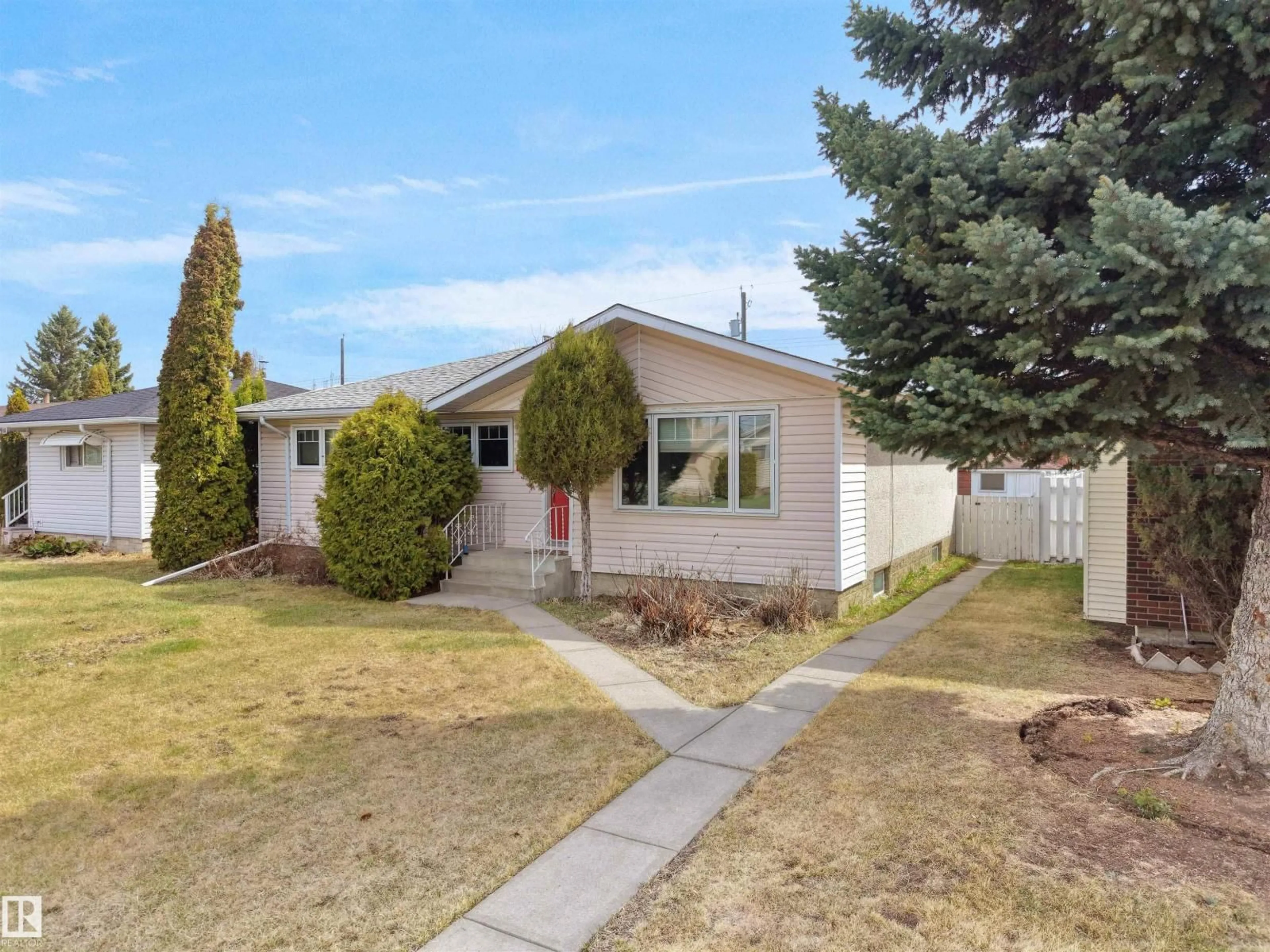 Home with vinyl exterior material, street for NW - 8703 73 ST, Edmonton Alberta T6B1Z9