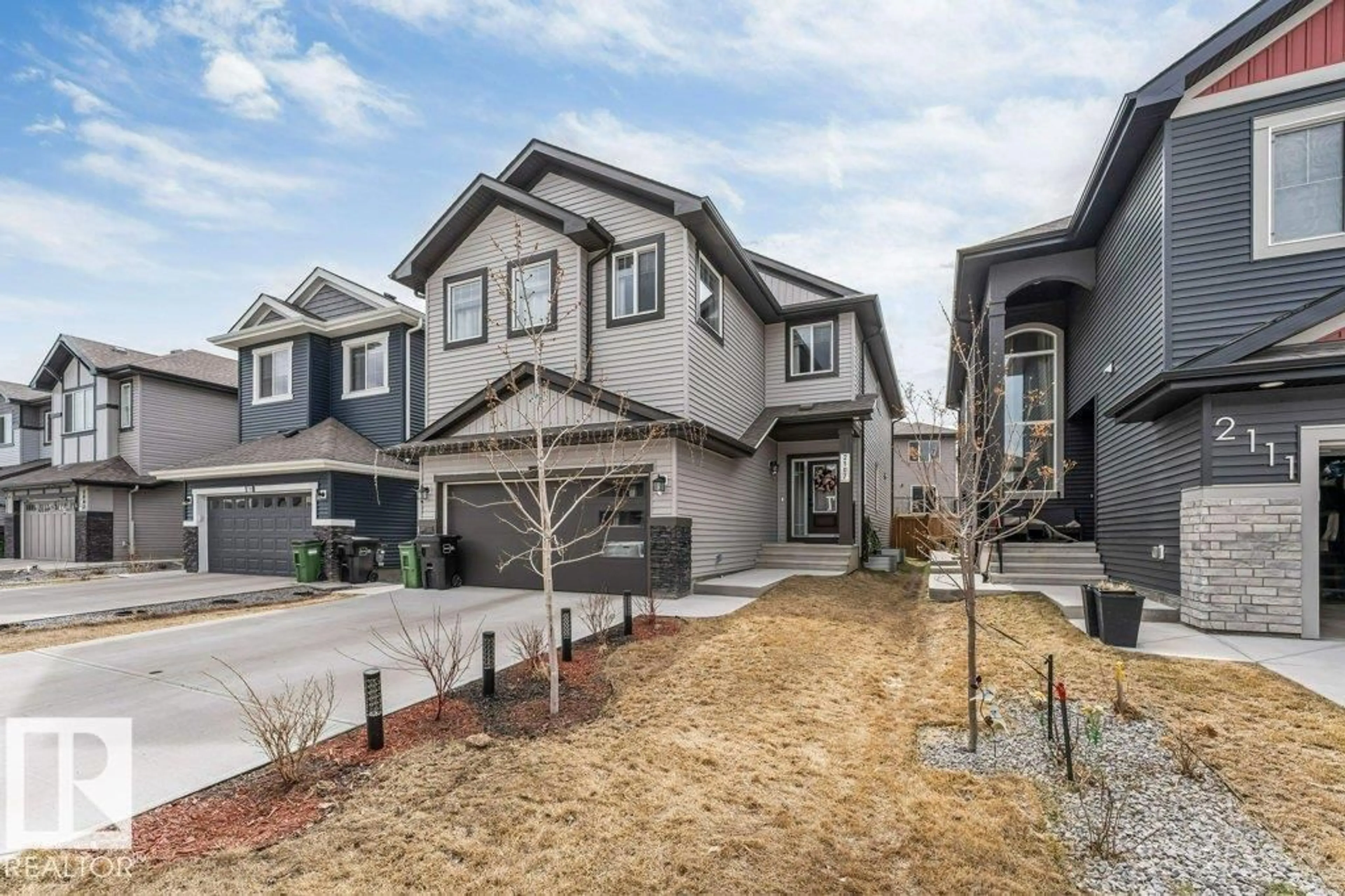 Home with vinyl exterior material, street for 2107 14 AV, Edmonton Alberta T6T2R6