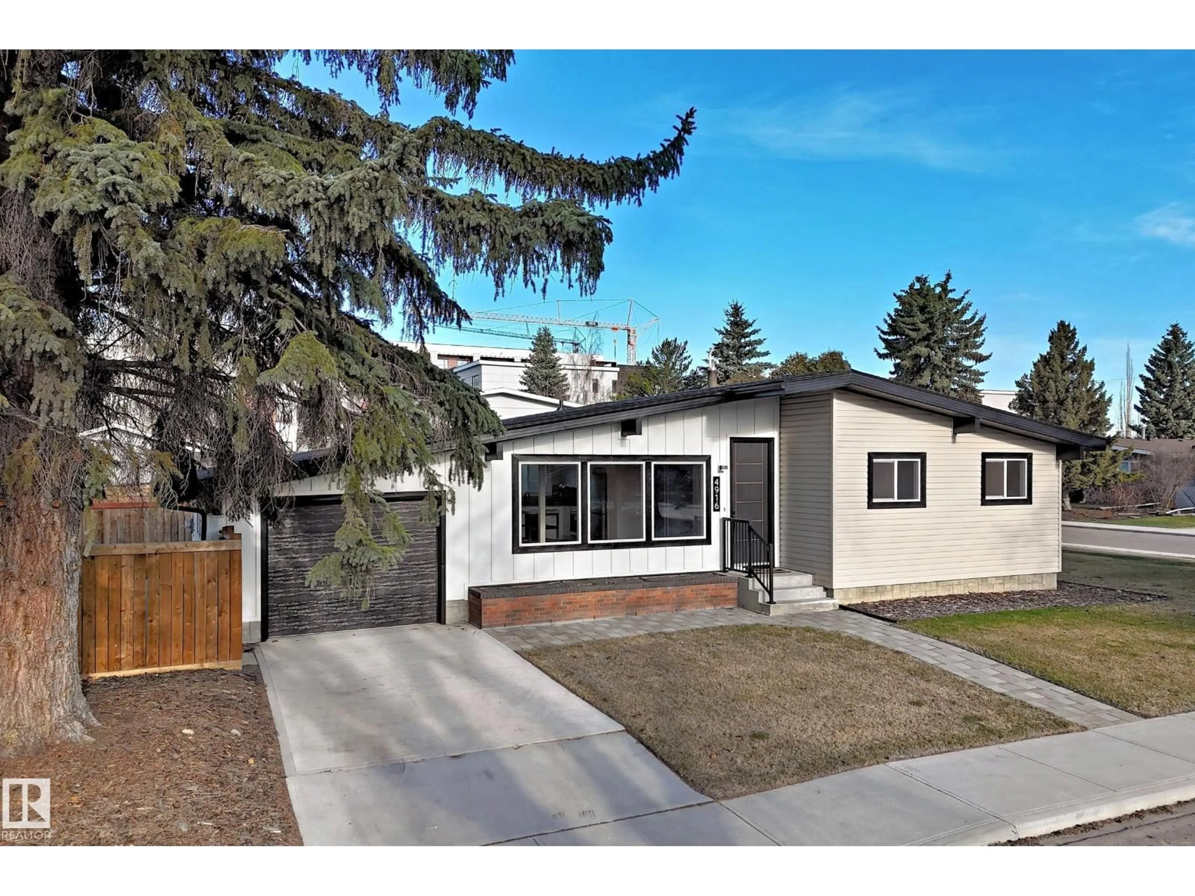 Home with vinyl exterior material, street for NW - 4916 116A ST, Edmonton Alberta T6H3R6