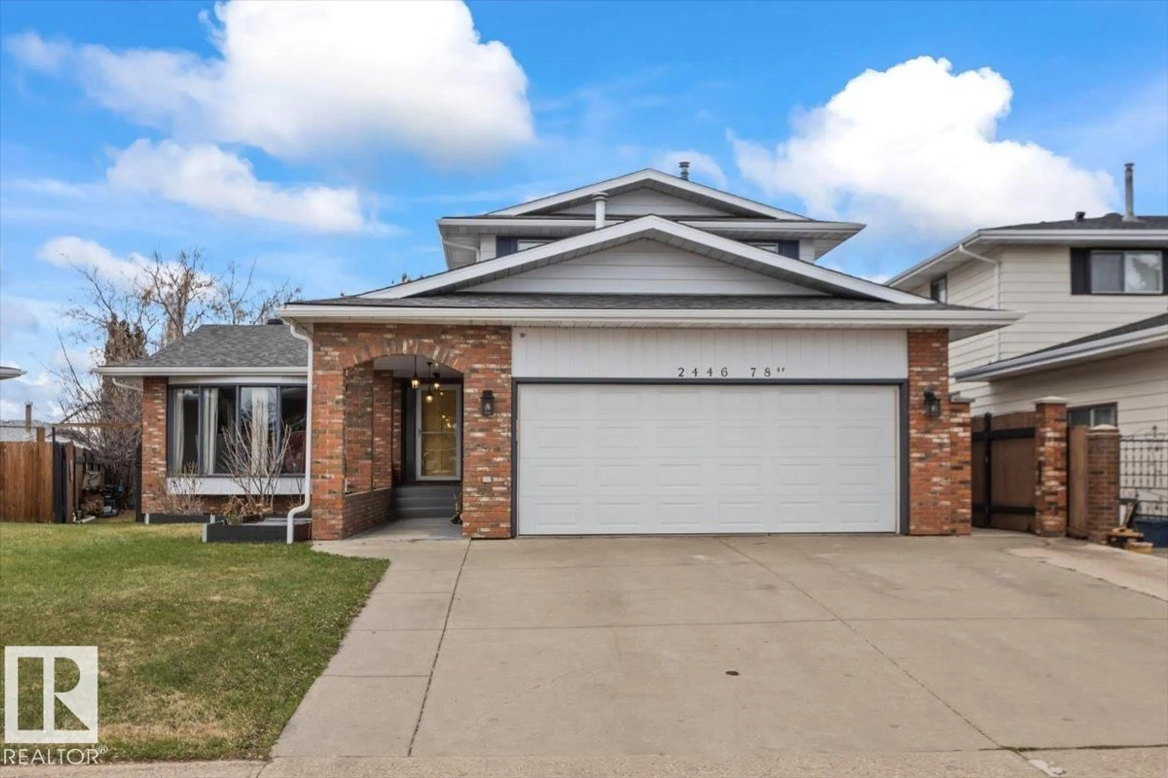 Home with vinyl exterior material, street for 2446 78 ST, Edmonton Alberta T6K3W4