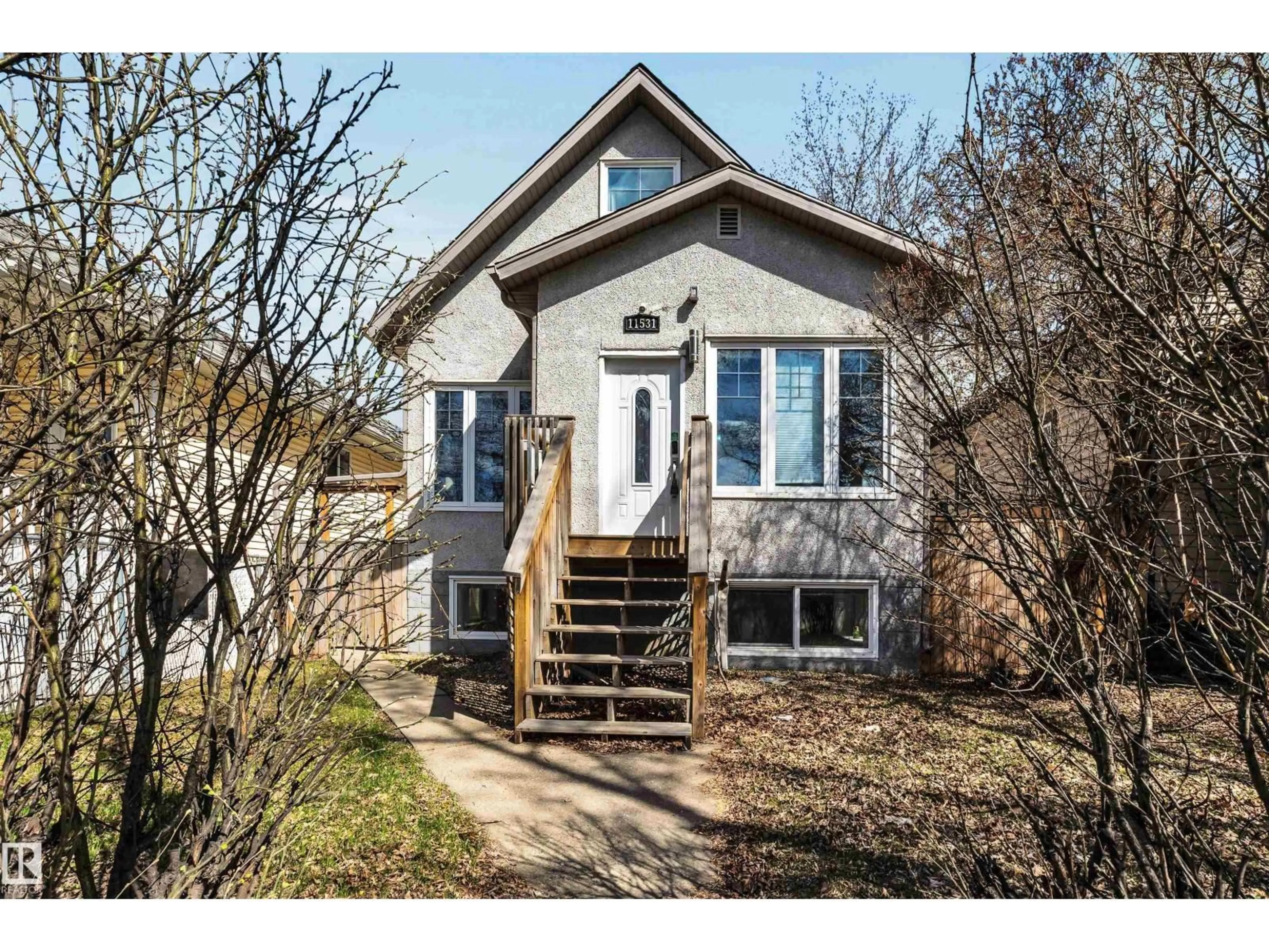 Home with vinyl exterior material, street for NW - 11531 97 ST, Edmonton Alberta T5G1X7