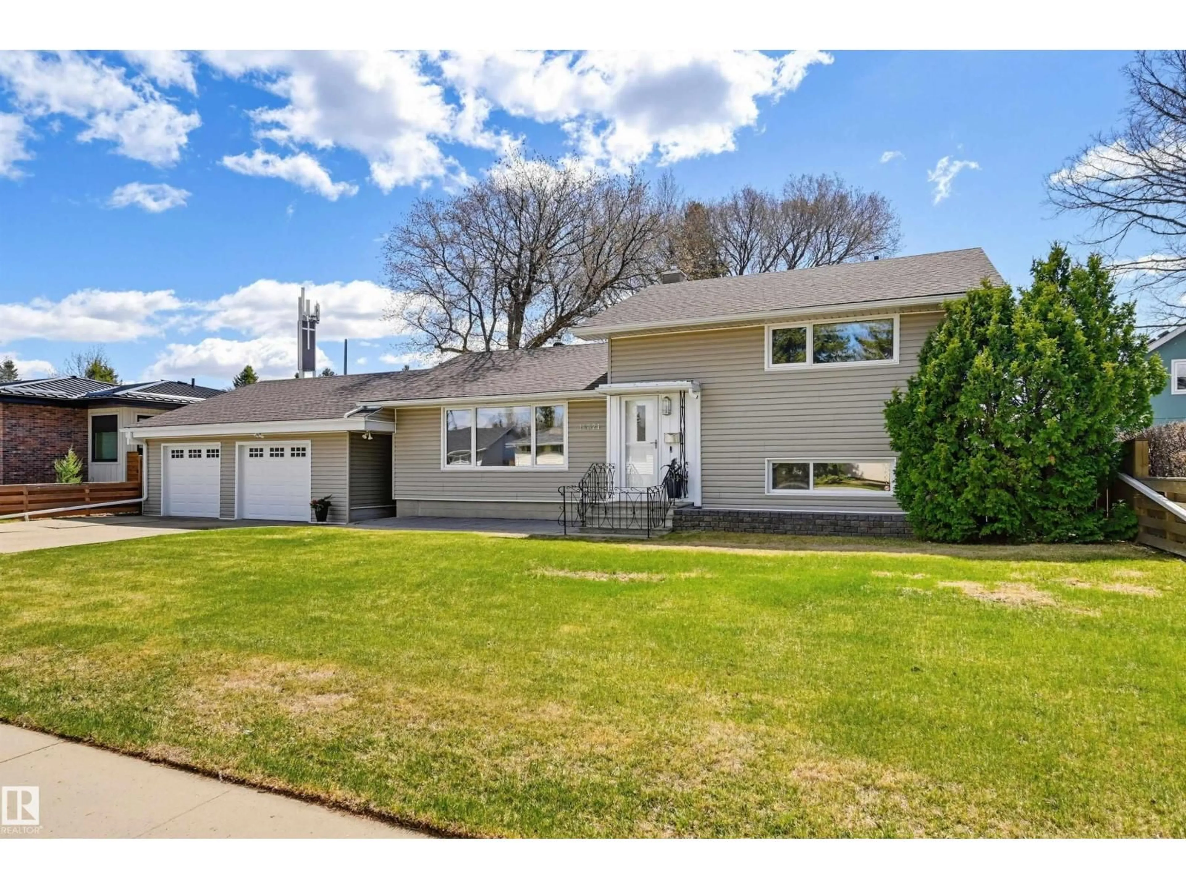 Home with vinyl exterior material, street for 14521 85 AV, Edmonton Alberta T5R3Z5