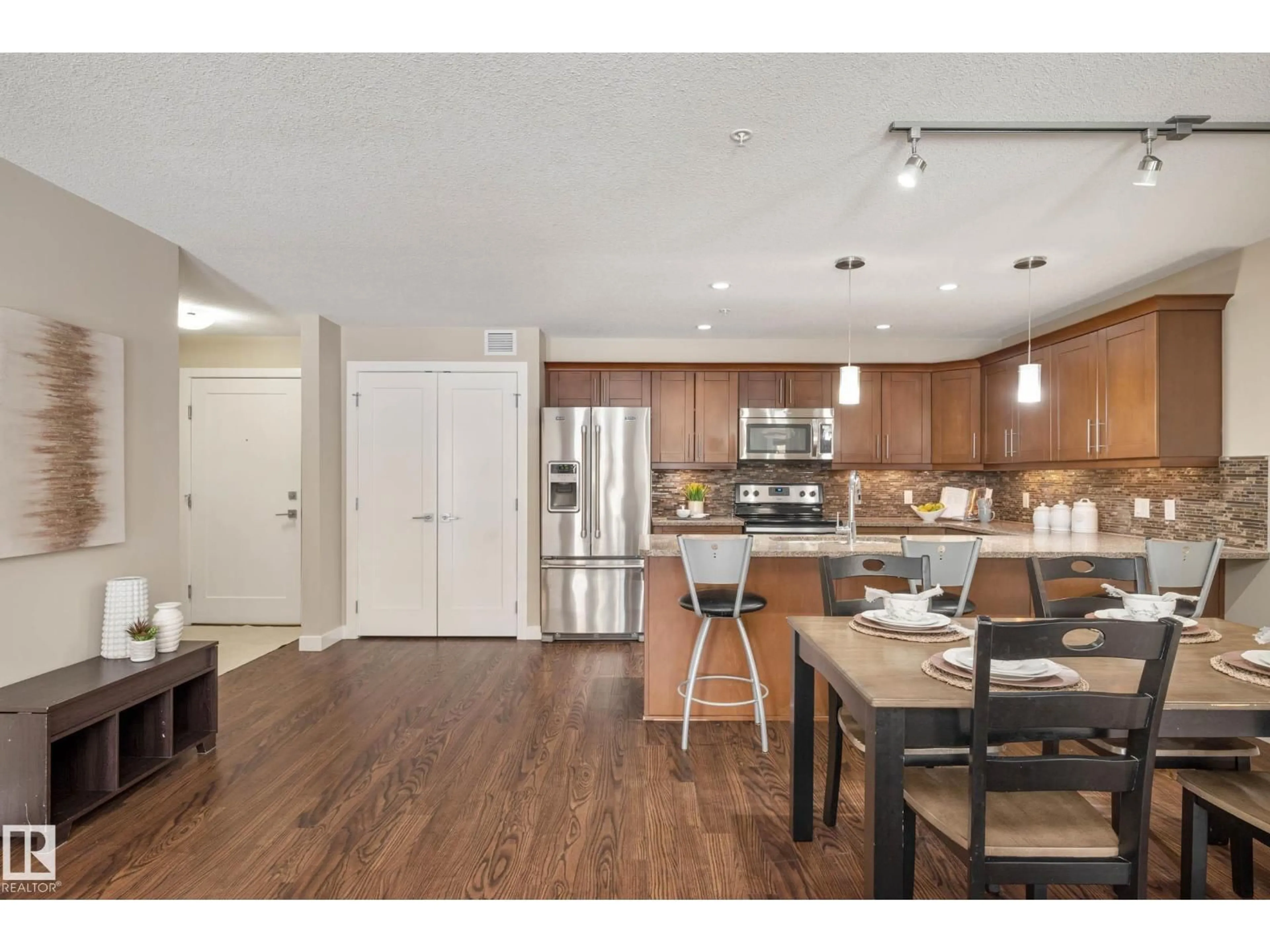 Open concept kitchen, wood/laminate floor for 1031 - 119 173 ST, Edmonton Alberta T6W3E4