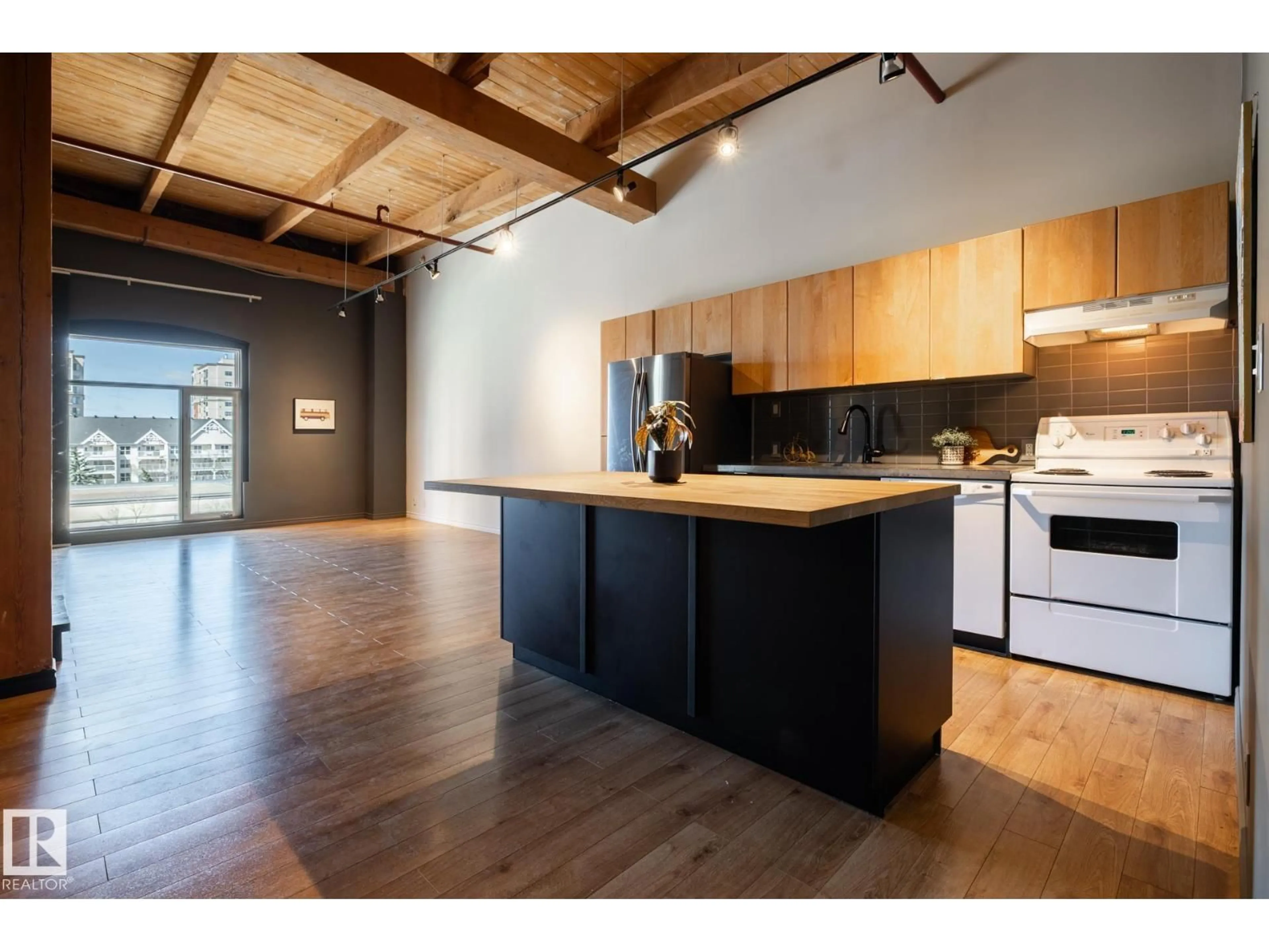 Open concept kitchen, wood/laminate floor for #407 - 10301 109 ST, Edmonton Alberta T5J1N4