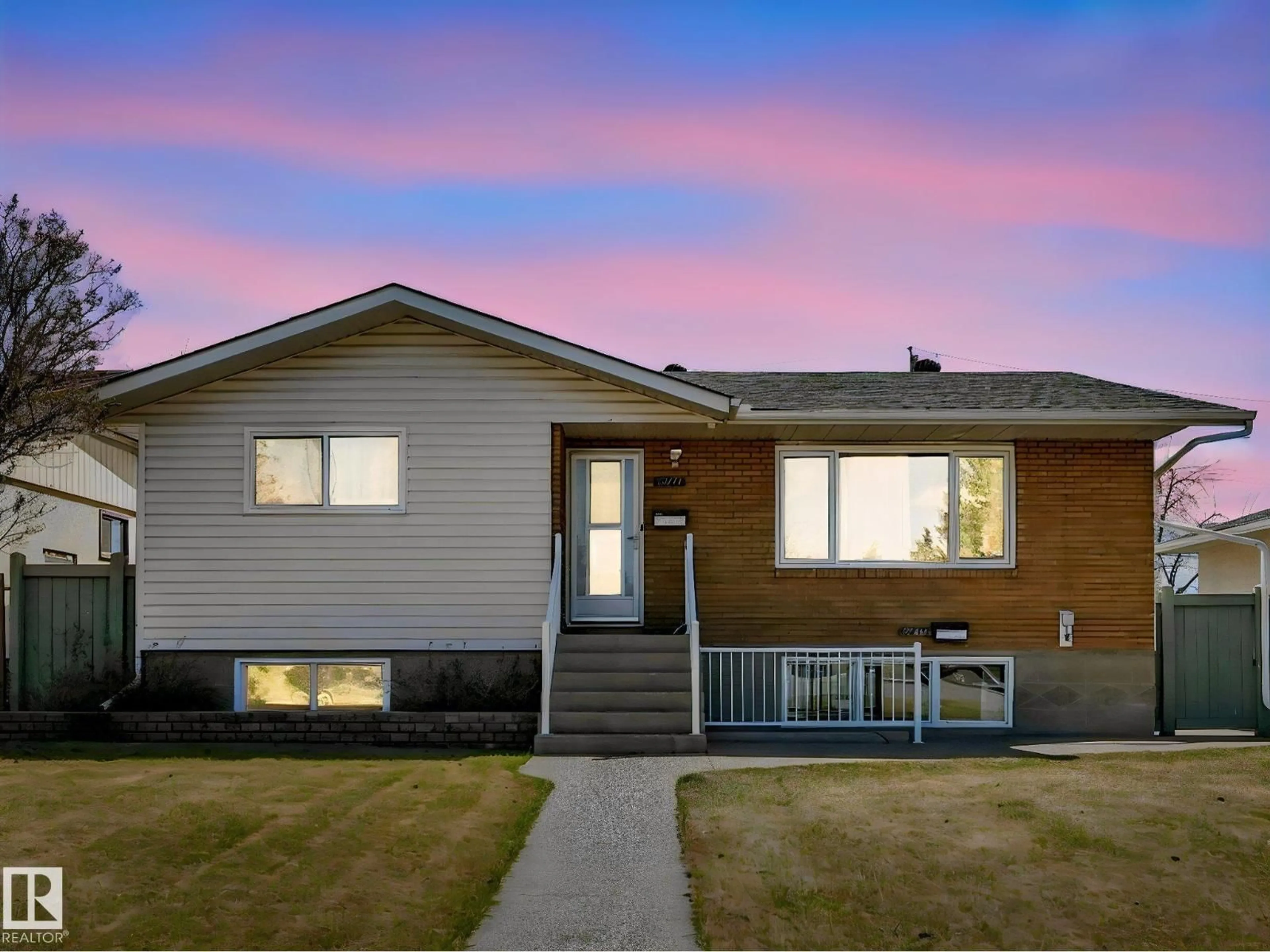Home with vinyl exterior material, street for 12715 95 ST, Edmonton Alberta T5E3X8