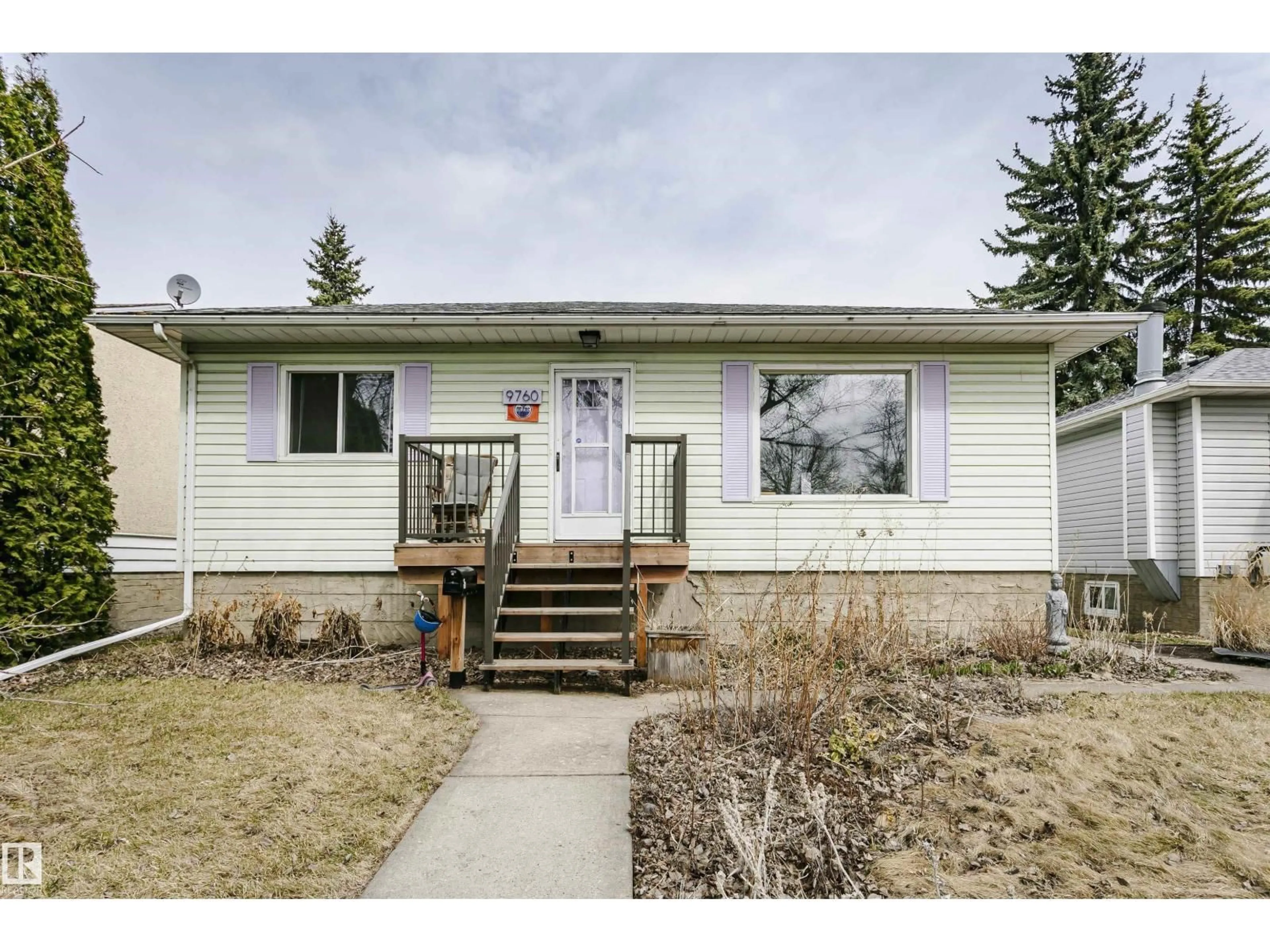 Home with vinyl exterior material, street for 9760 64 AV, Edmonton Alberta T6E0J5