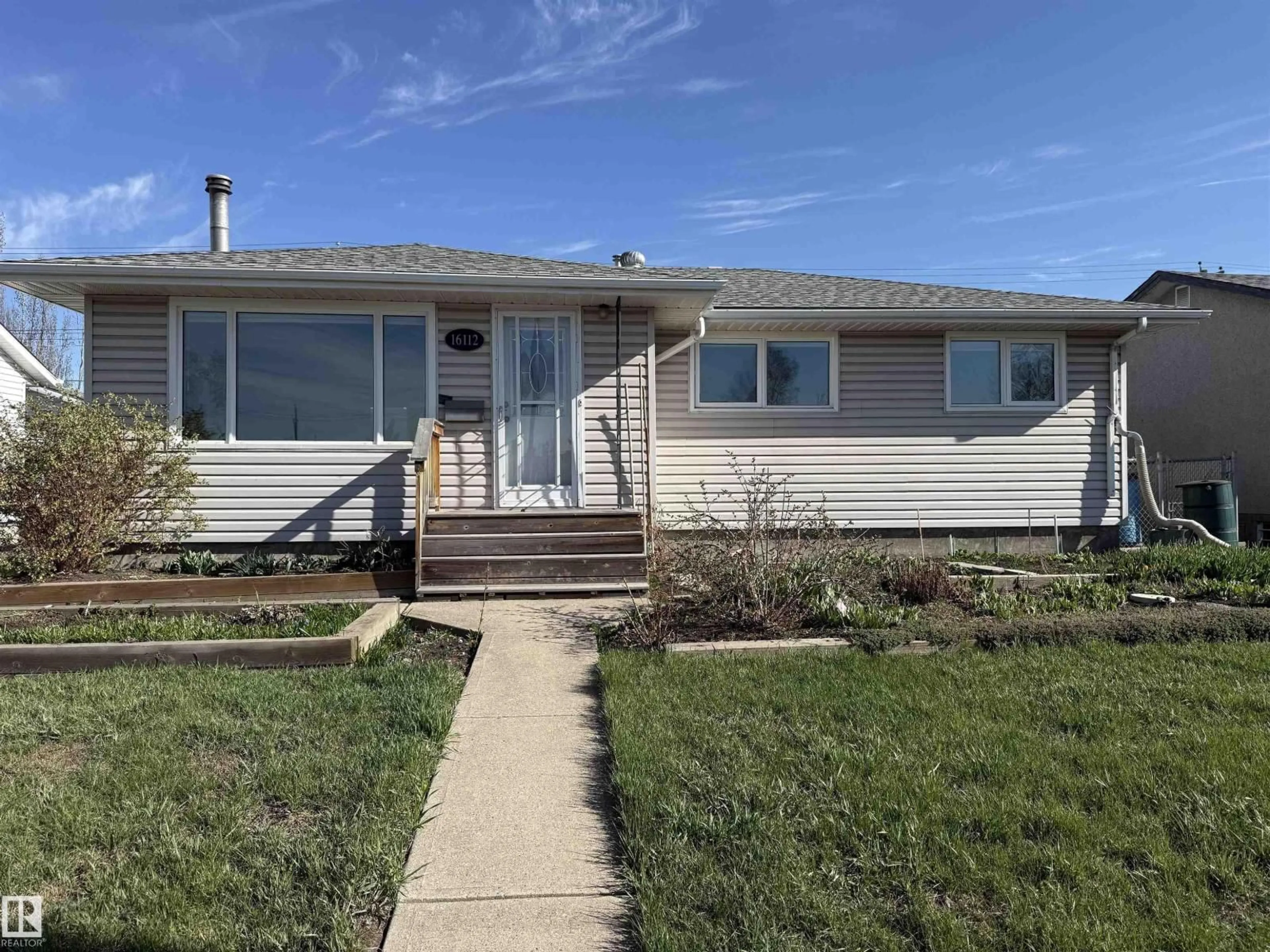 Home with vinyl exterior material, street for 16112 87 AV, Edmonton Alberta T5R4G9