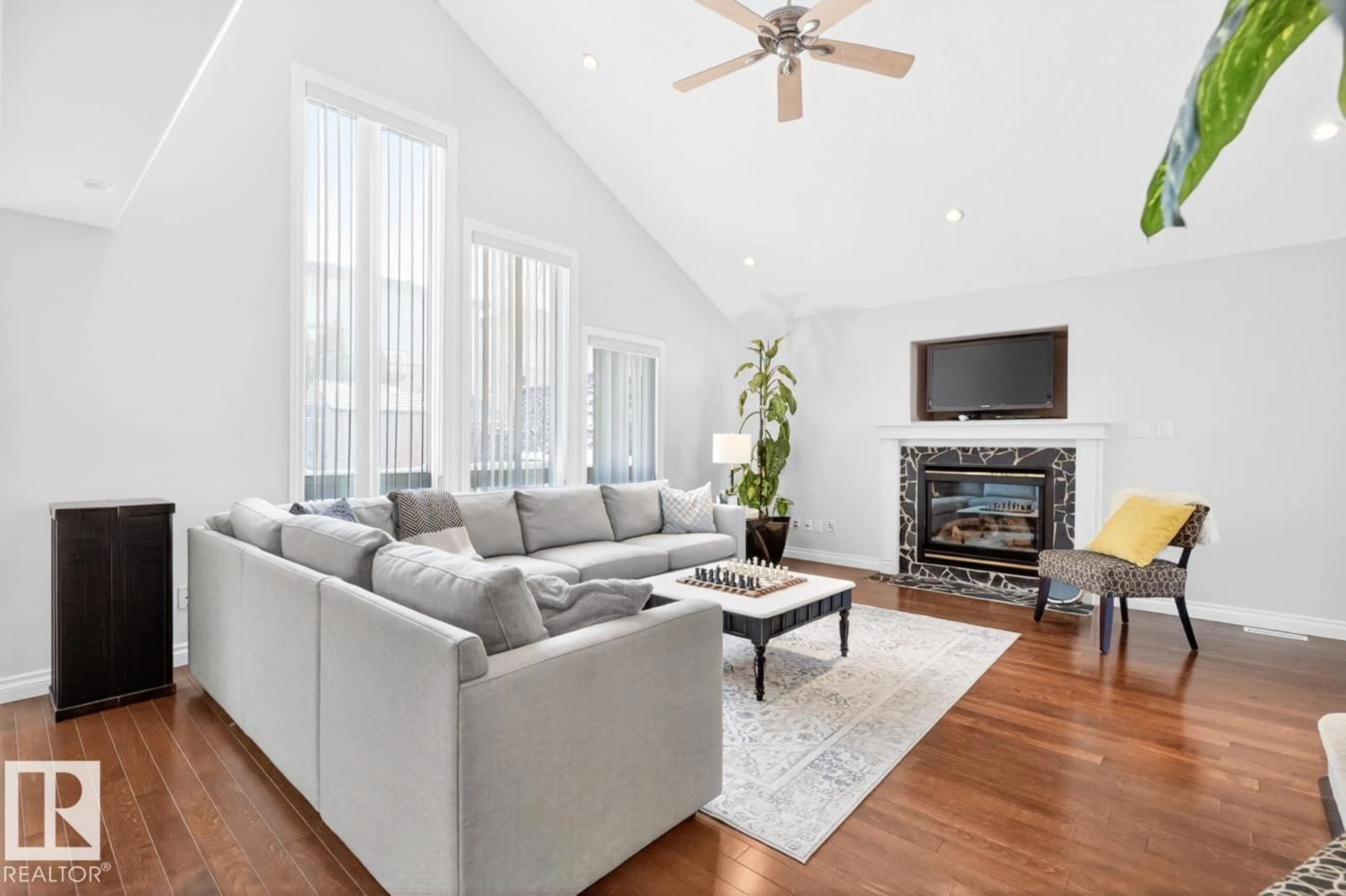 Living room with furniture, wood/laminate floor for 22 ORCHID CR, Sherwood Park Alberta T8H2E1