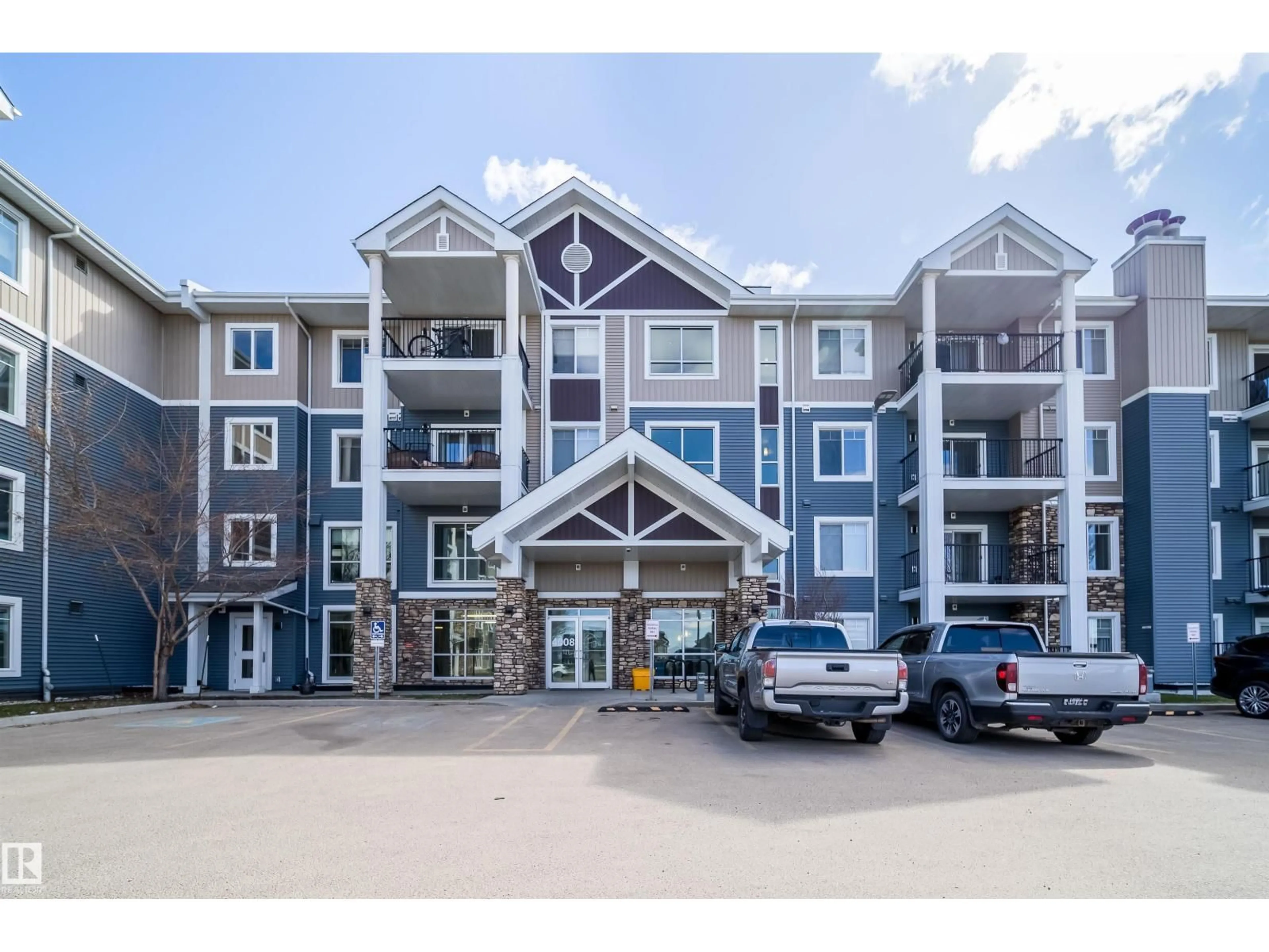 A pic from outside/outdoor area/front of a property/back of a property/a pic from drone, unknown for #421 - 4008 SAVARYN DR, Edmonton Alberta T6X2E5