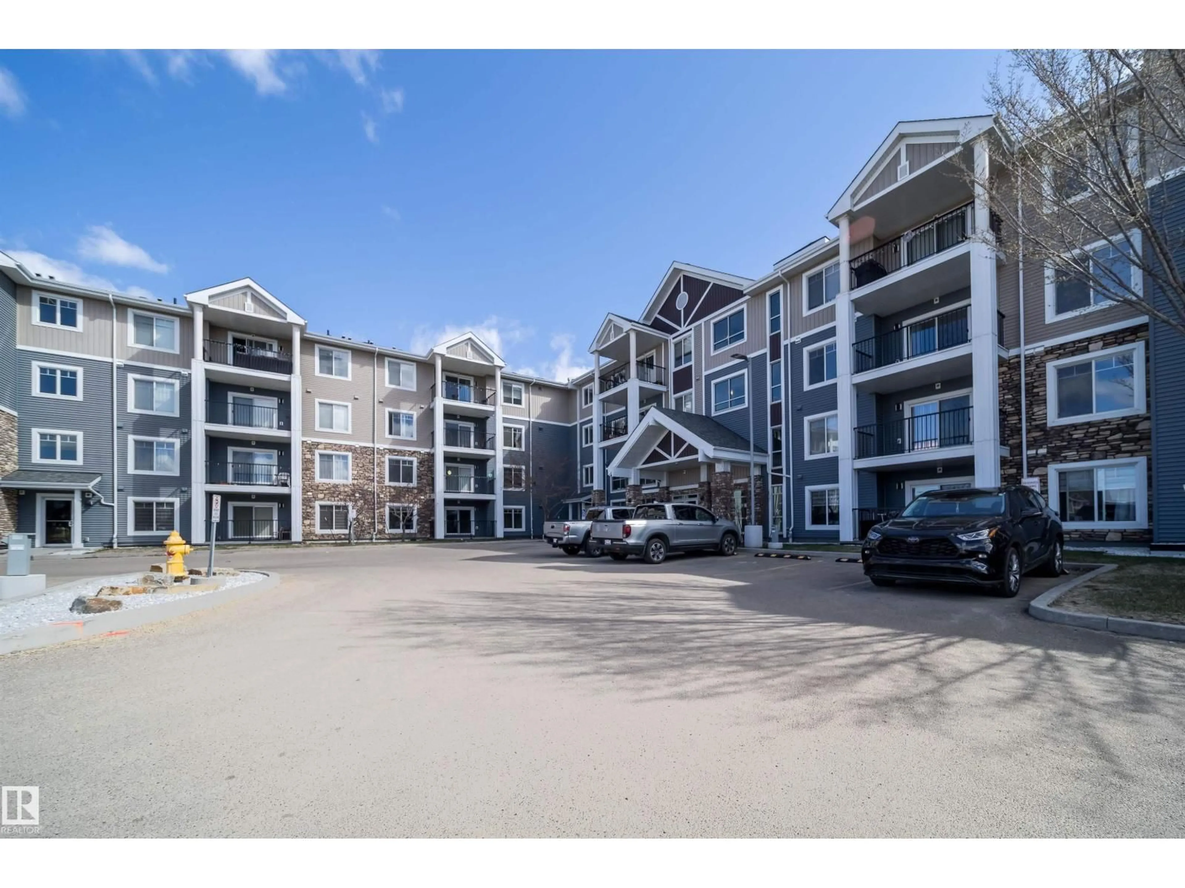 A pic from outside/outdoor area/front of a property/back of a property/a pic from drone, unknown for #421 - 4008 SAVARYN DR, Edmonton Alberta T6X2E5