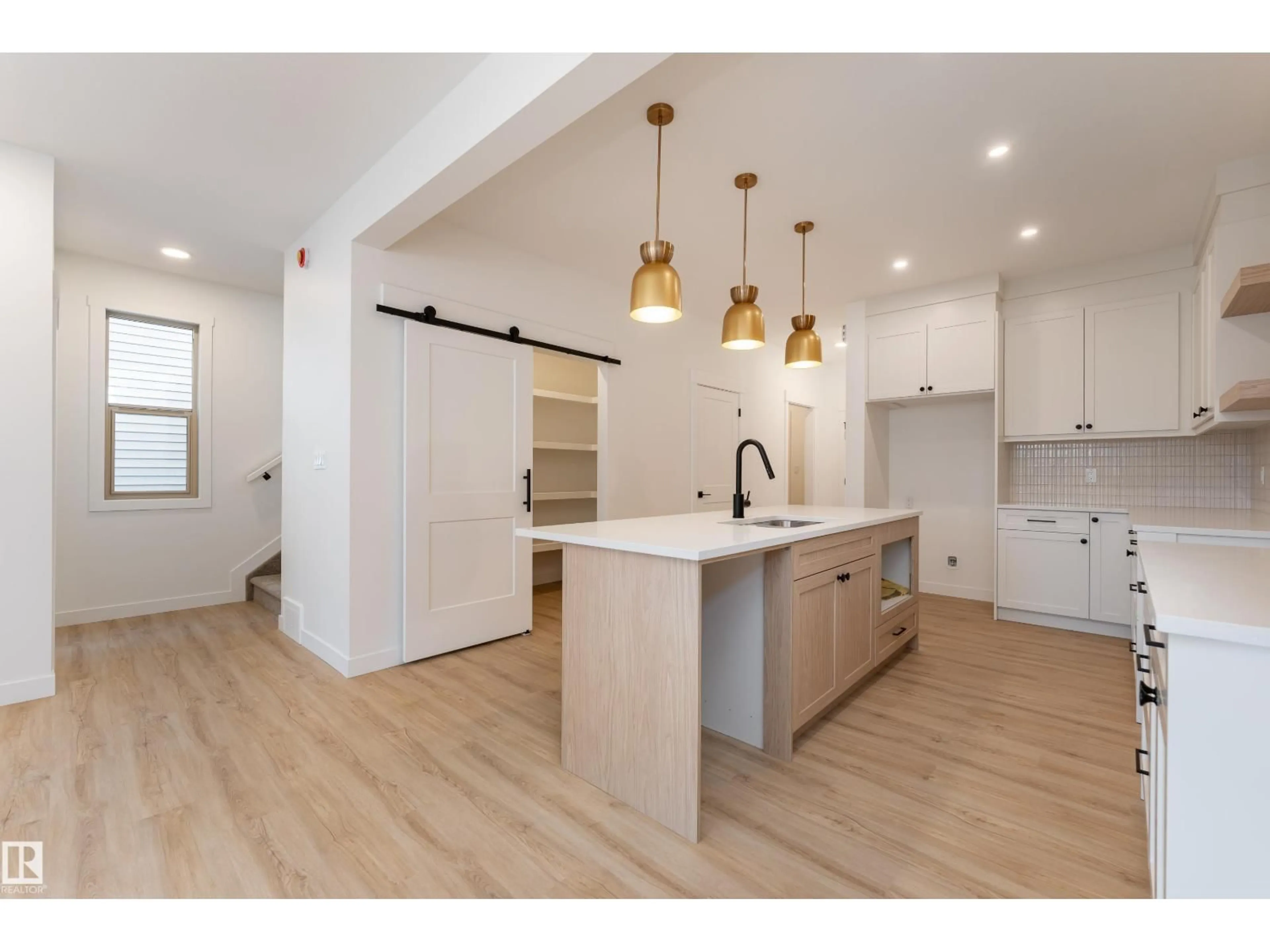 Open concept kitchen, wood/laminate floor for 12 GABLE CM, Spruce Grove Alberta T7X2W2