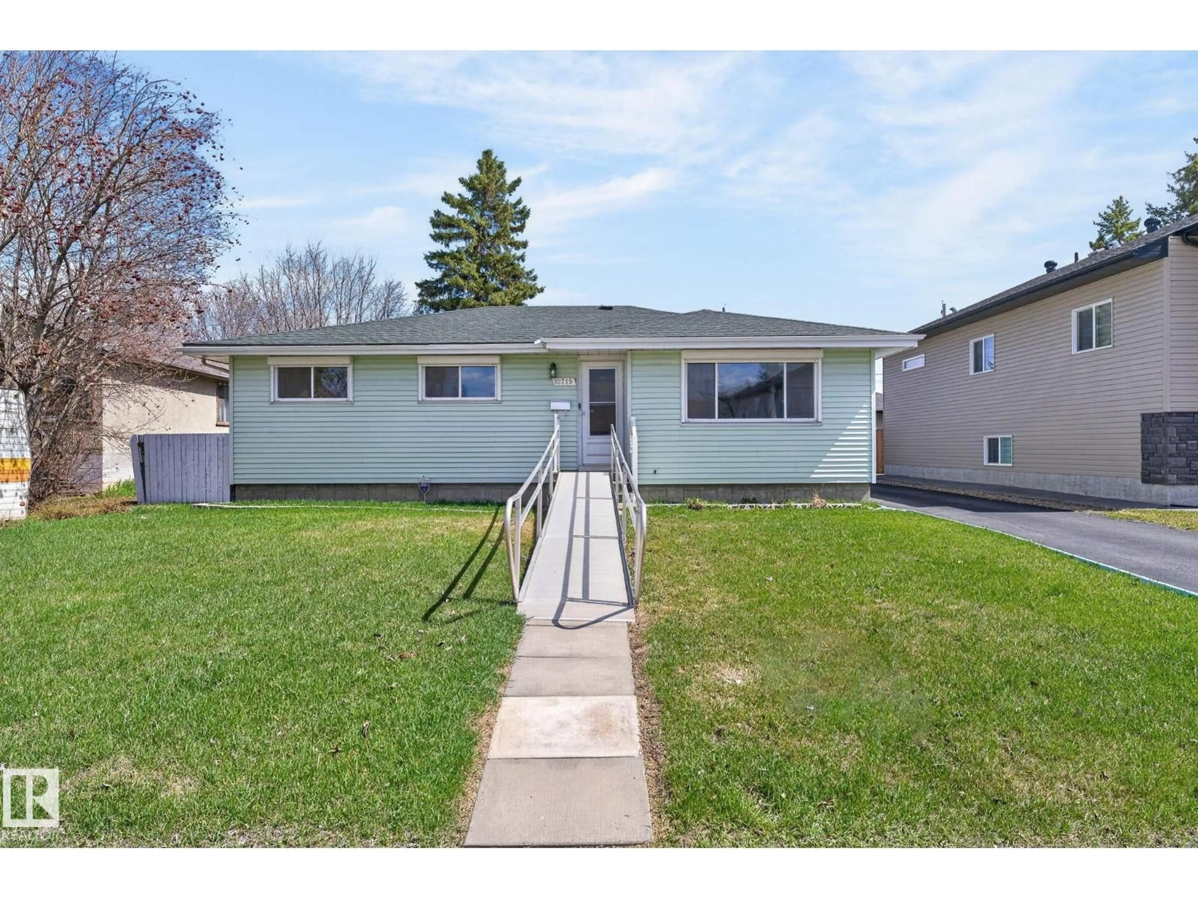 Home with vinyl exterior material, street for NW - 10719 152 ST, Edmonton Alberta T5P1Z2