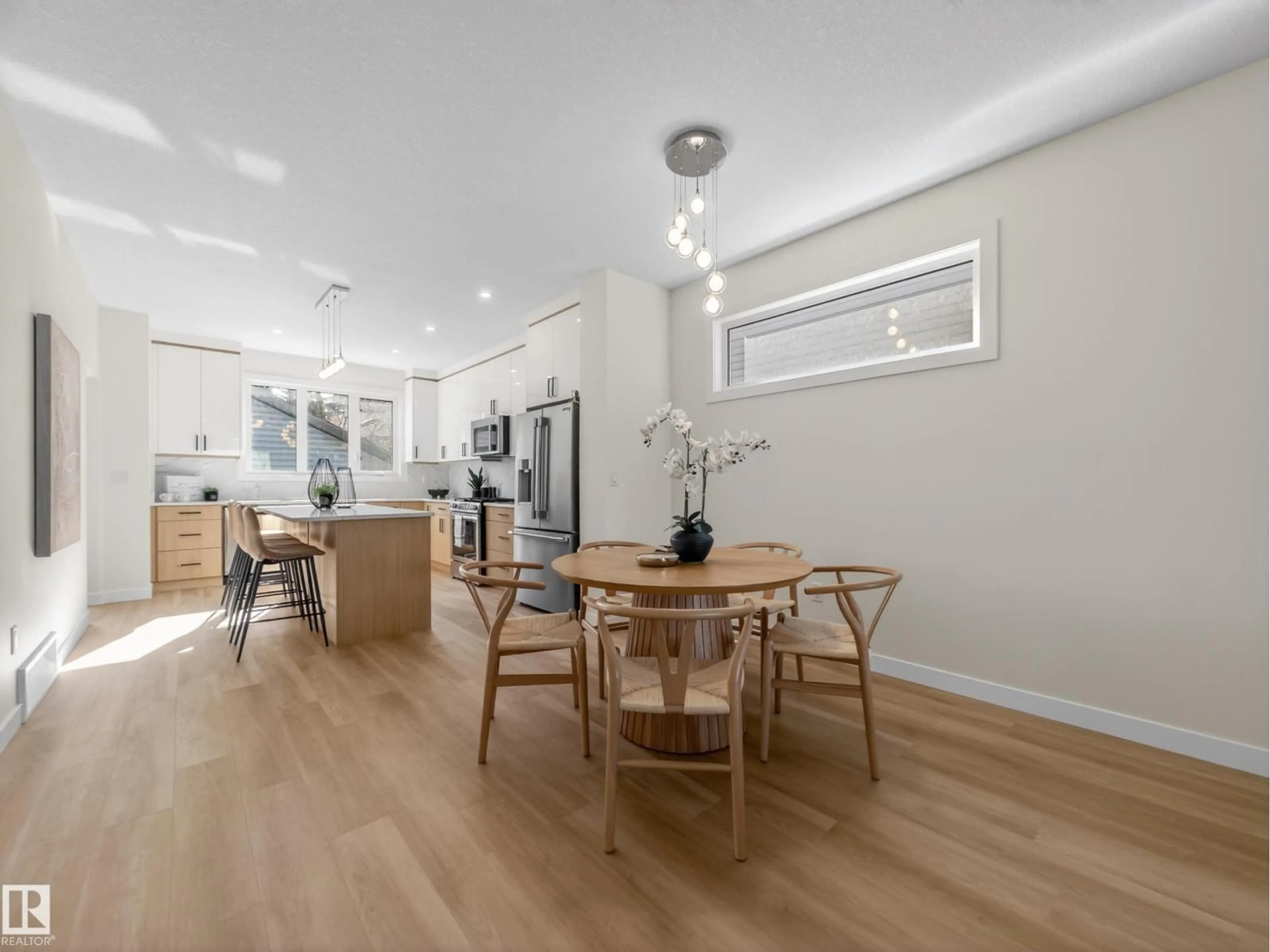 Open concept kitchen, wood/laminate floor for 8713 149 ST, Edmonton Alberta T5R1B5