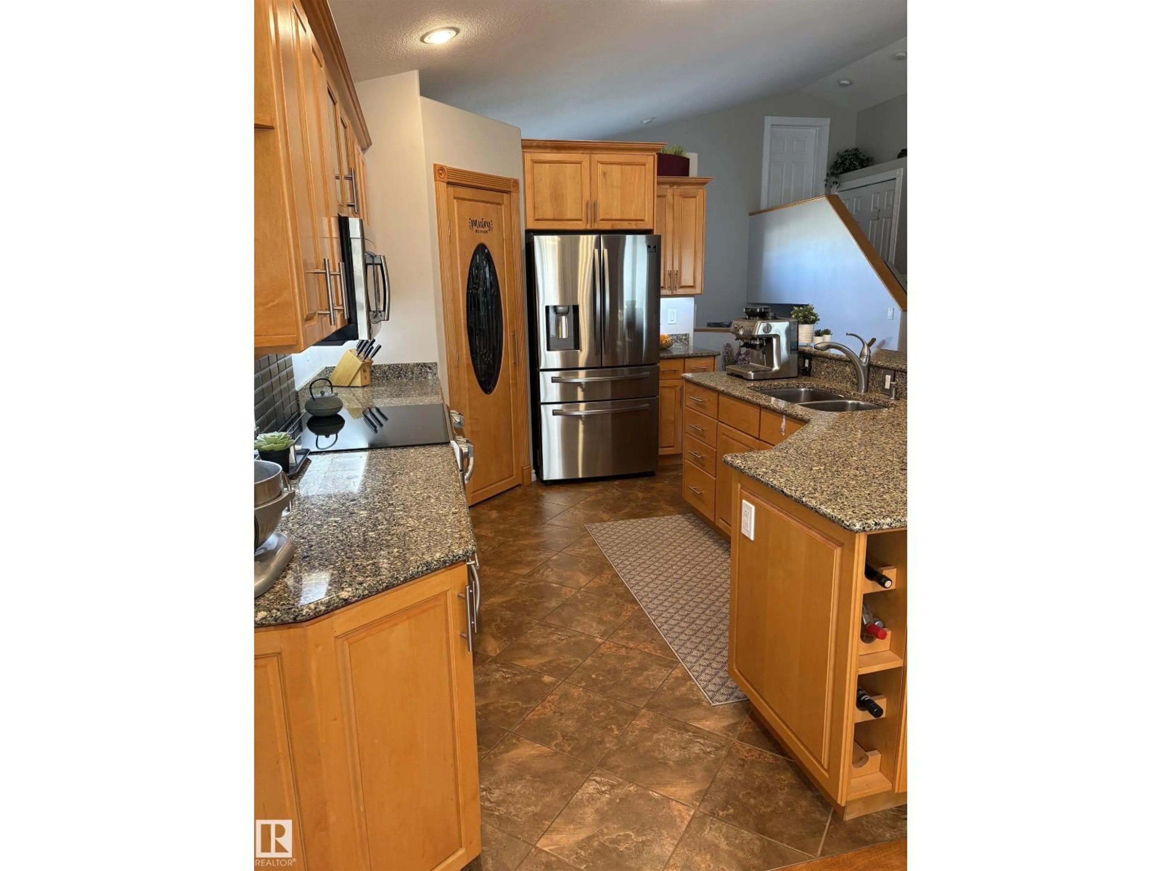 Open concept kitchen, ceramic/tile floor for 11103 103 ST, Westlock Alberta T7P1G6