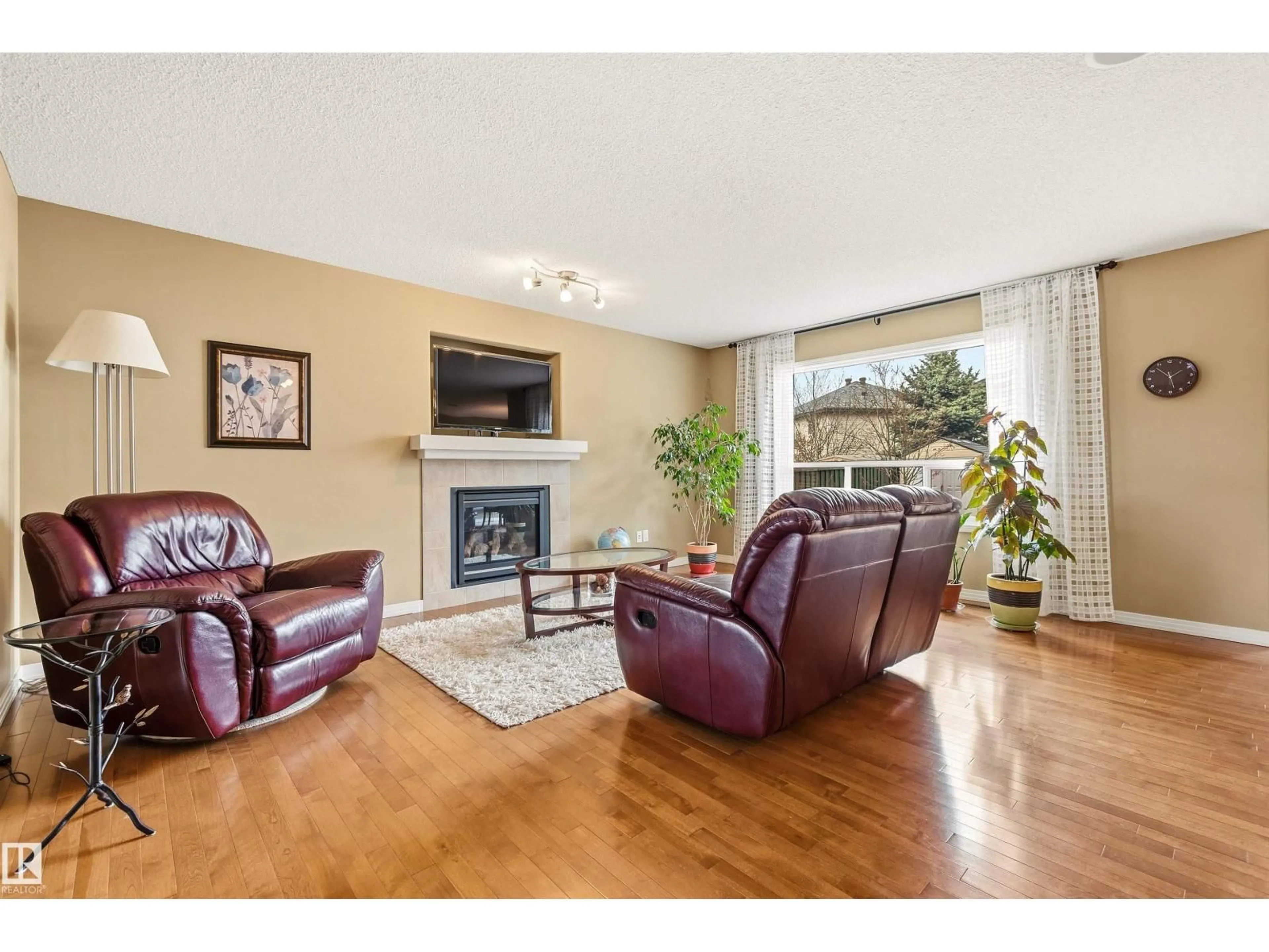 Living room with furniture, wood/laminate floor for NW - 2340 HAGEN LINK LI, Edmonton Alberta T6R0B2