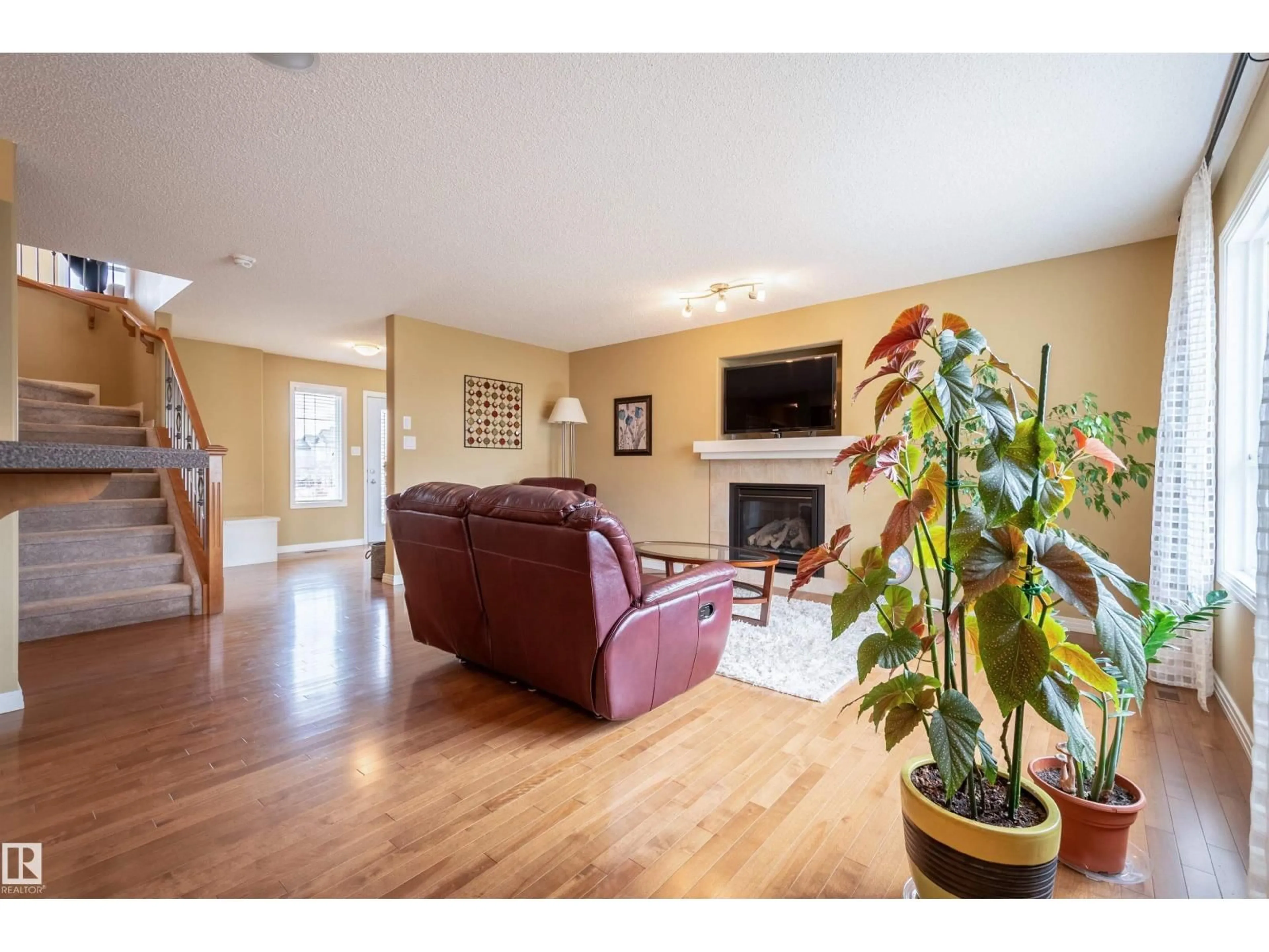 Living room with furniture, wood/laminate floor for NW - 2340 HAGEN LINK LI, Edmonton Alberta T6R0B2