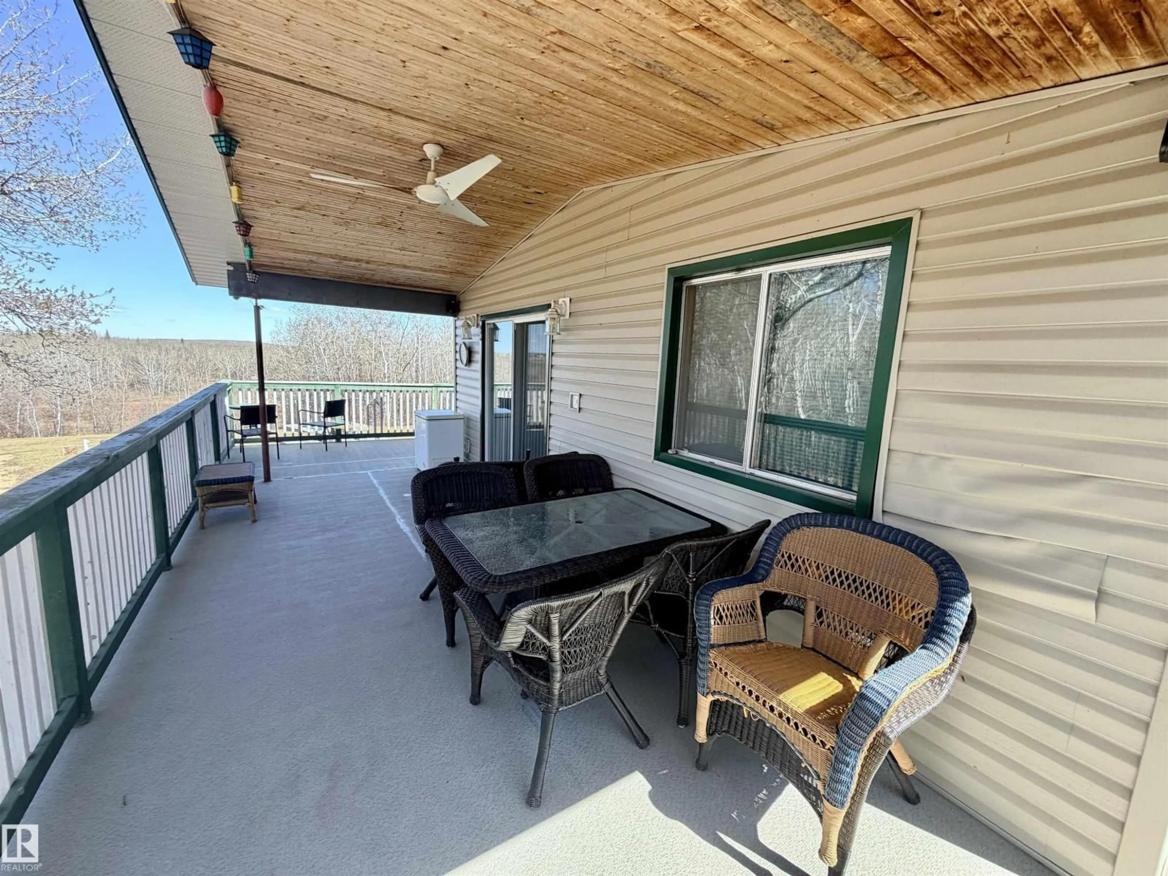 Patio, water/lake/river/ocean view for 562007 - 61 RR 113 RR, Rural Two Hills County Alberta T0B4K0