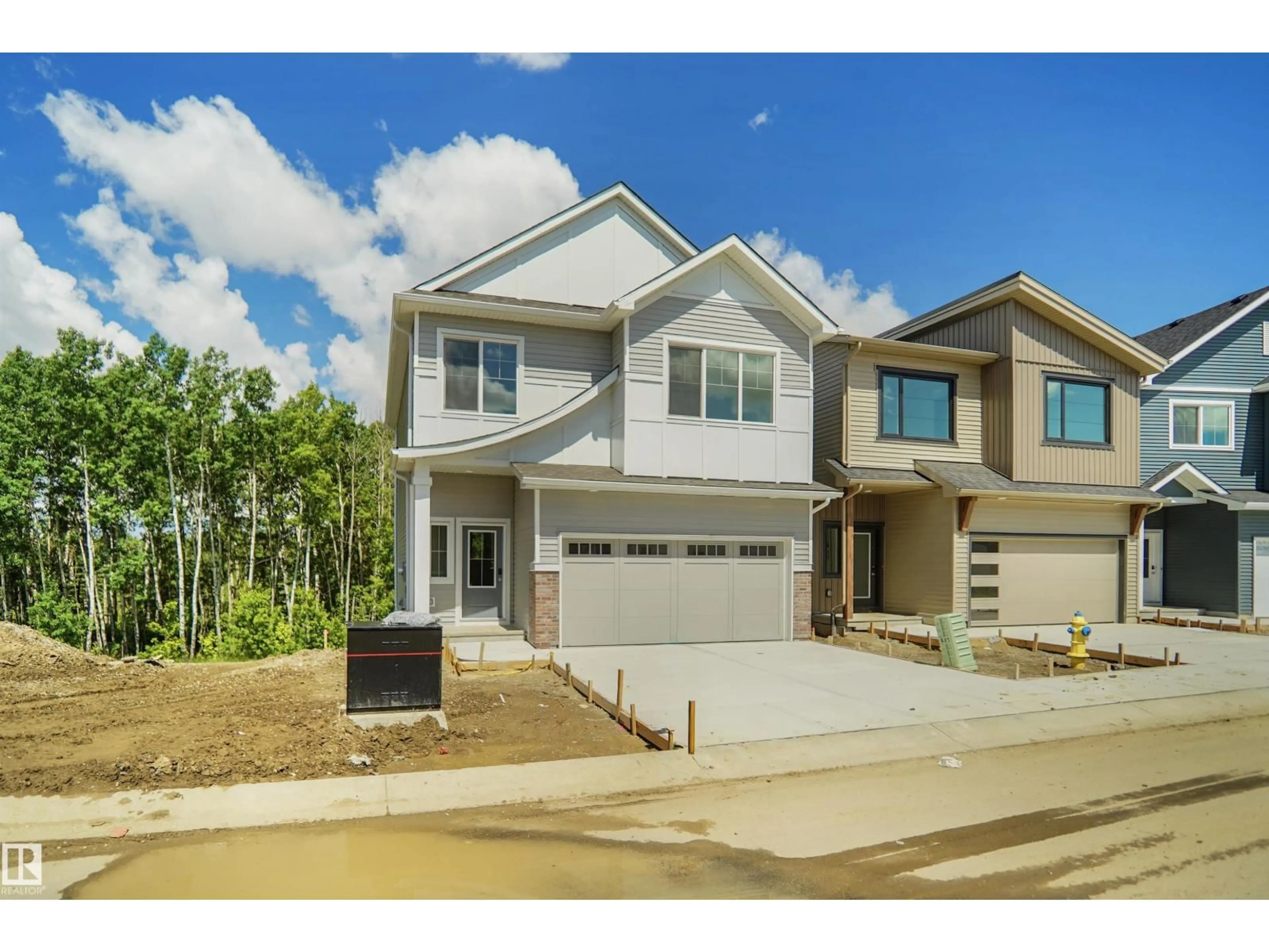 Home with vinyl exterior material, street for #21 - 19904 31 AV, Edmonton Alberta T6M1N7