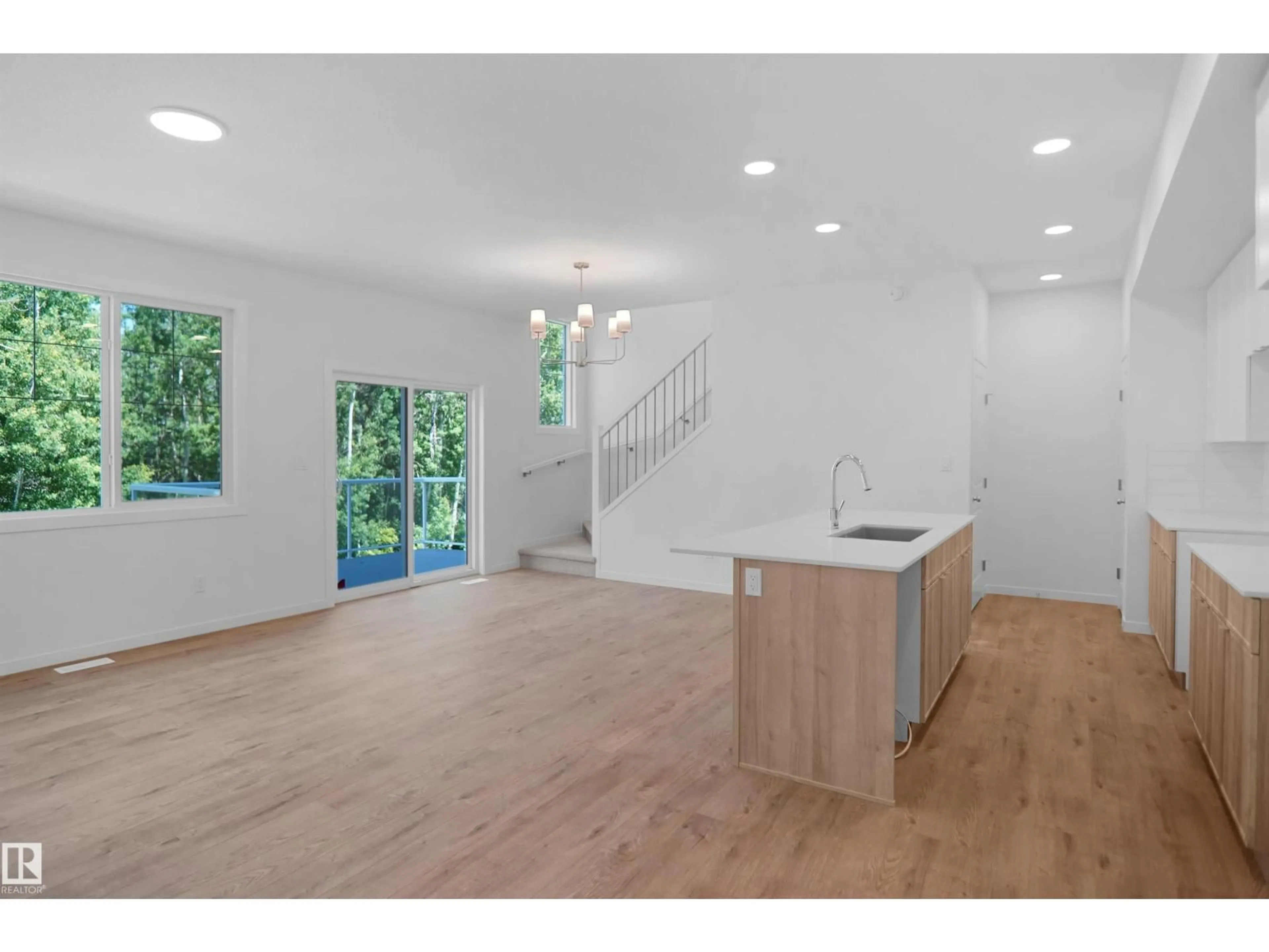 Open concept kitchen, wood/laminate floor for #21 - 19904 31 AV, Edmonton Alberta T6M1N7