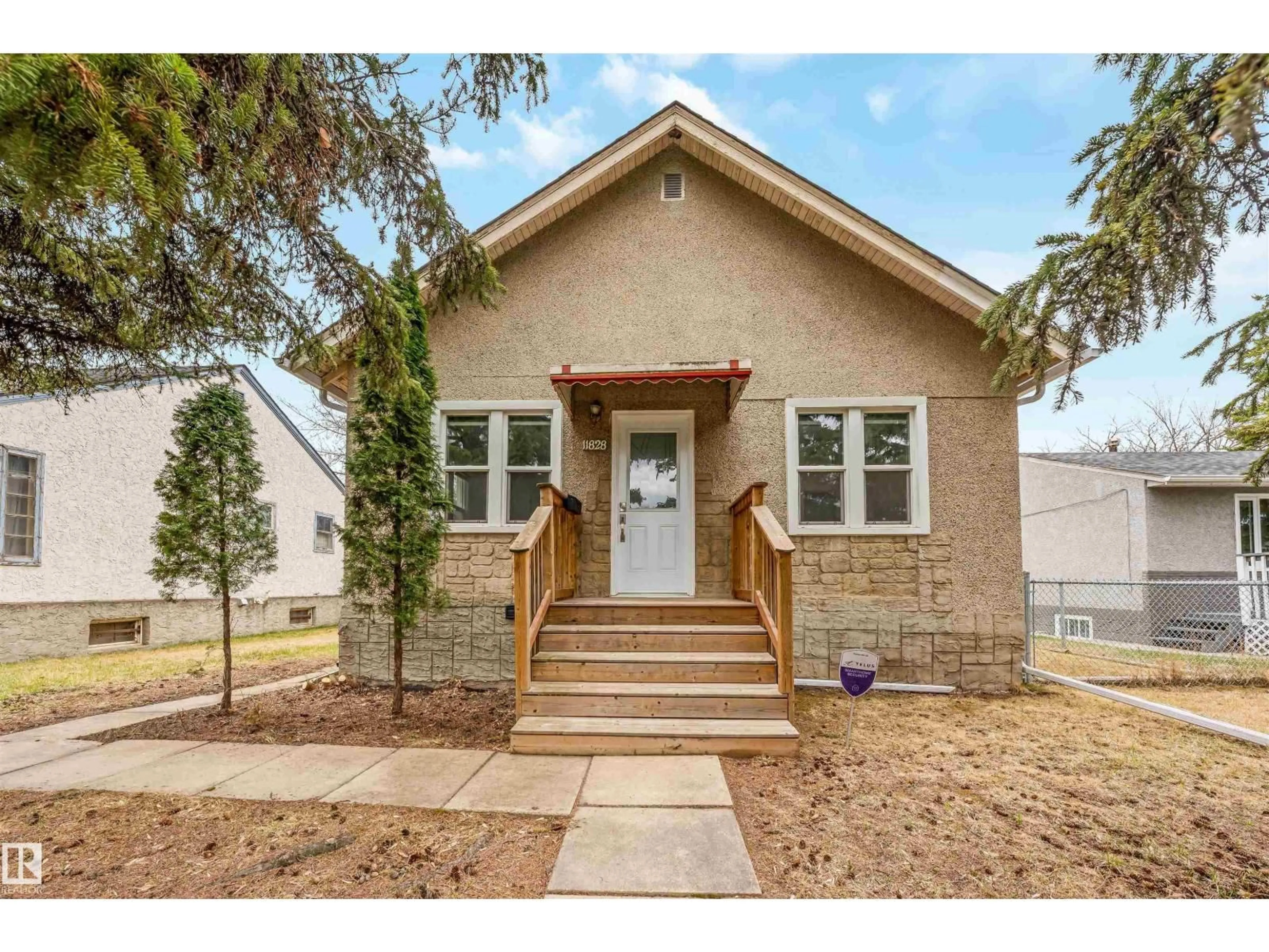 Home with brick exterior material, street for NW - 11828 50 ST, Edmonton Alberta T5W3B9
