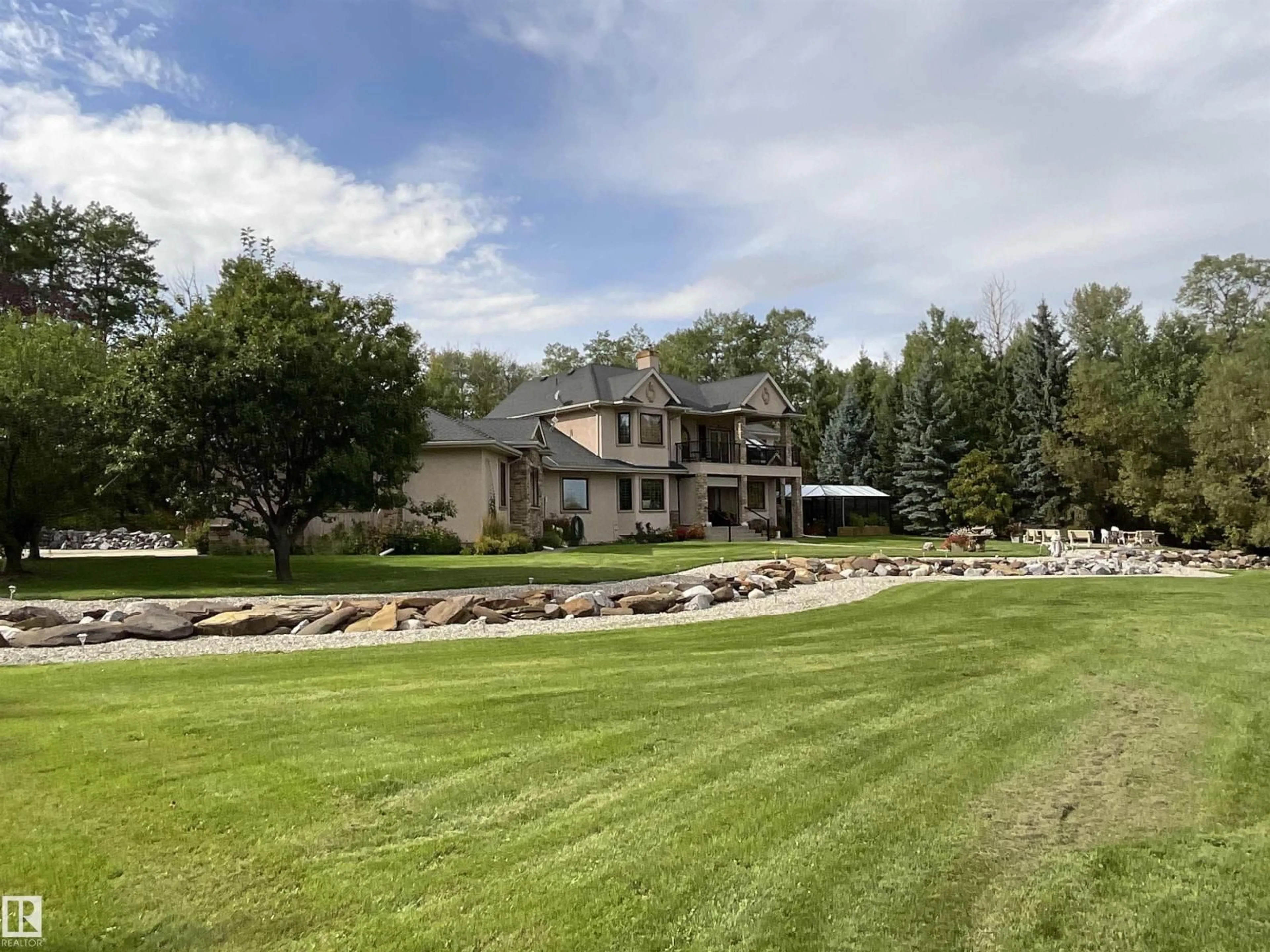 A pic from outside/outdoor area/front of a property/back of a property/a pic from drone, water/lake/river/ocean view for 22031 TWP RD 472, Rural Wetaskiwin County Alberta T0C2T0