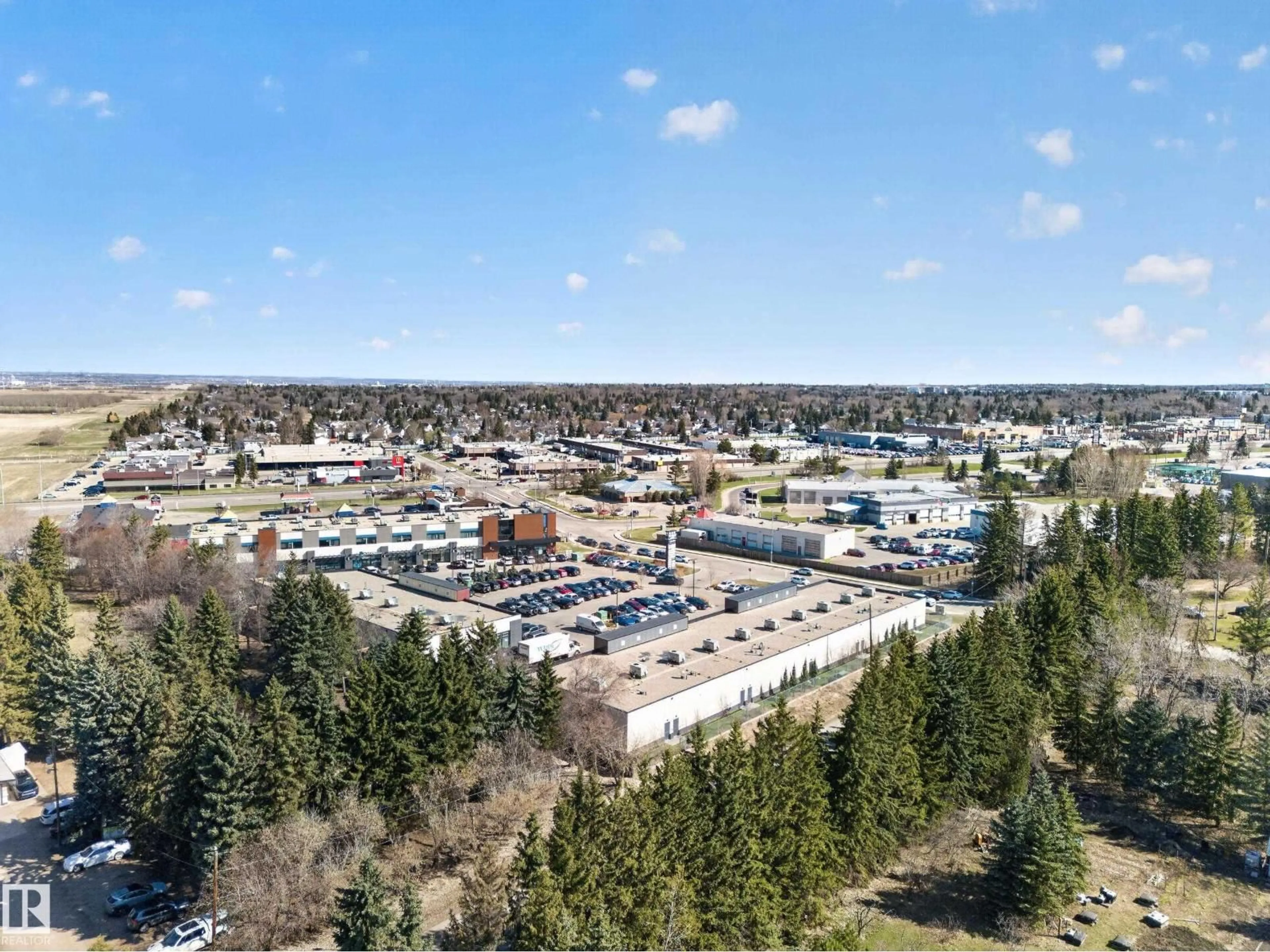 A pic from outside/outdoor area/front of a property/back of a property/a pic from drone, mountain view for 80 23333 WYE RD, Rural Strathcona County Alberta T8B1K4