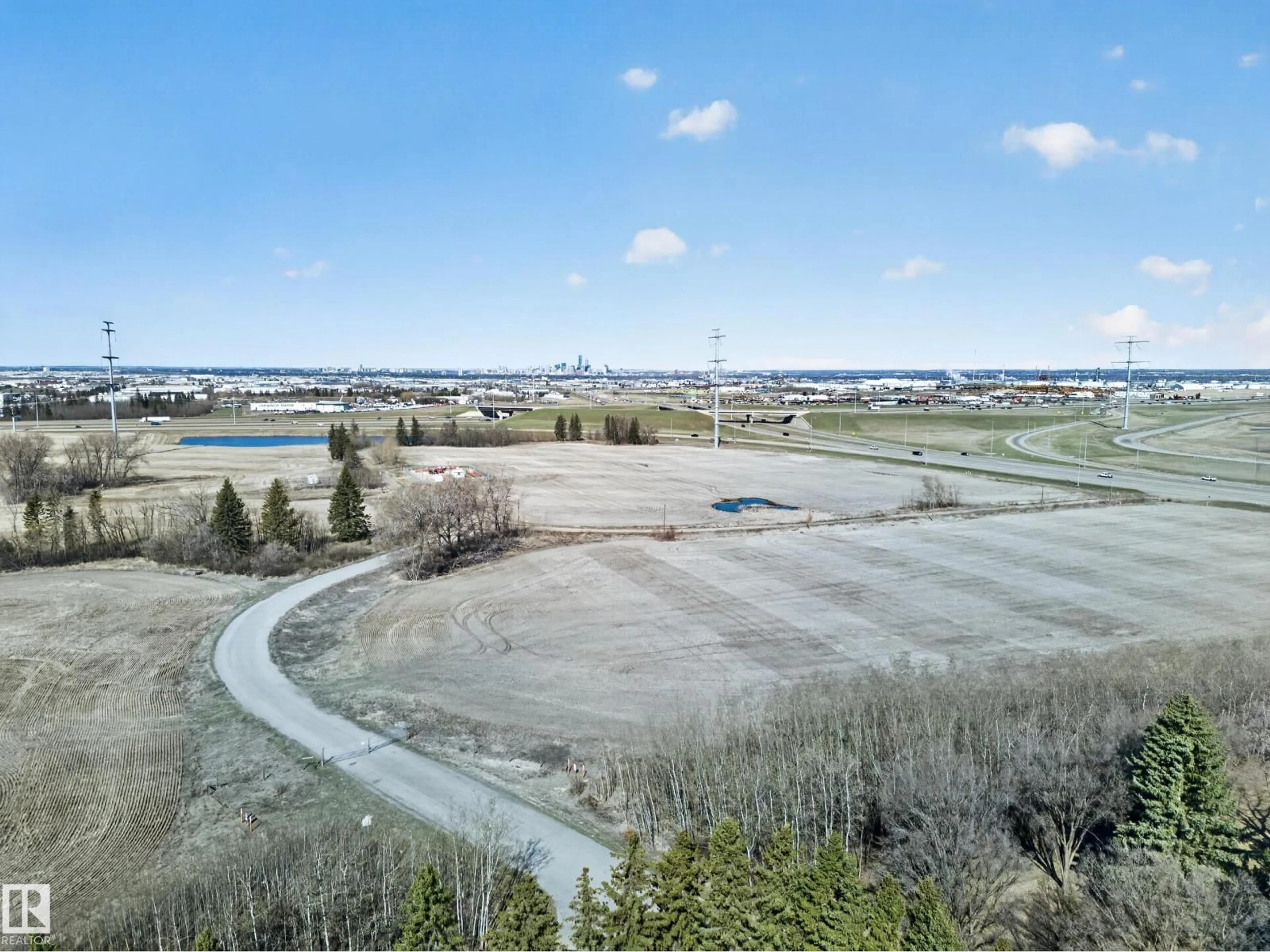A pic from outside/outdoor area/front of a property/back of a property/a pic from drone, water/lake/river/ocean view for 80 23333 WYE RD, Rural Strathcona County Alberta T8B1K4