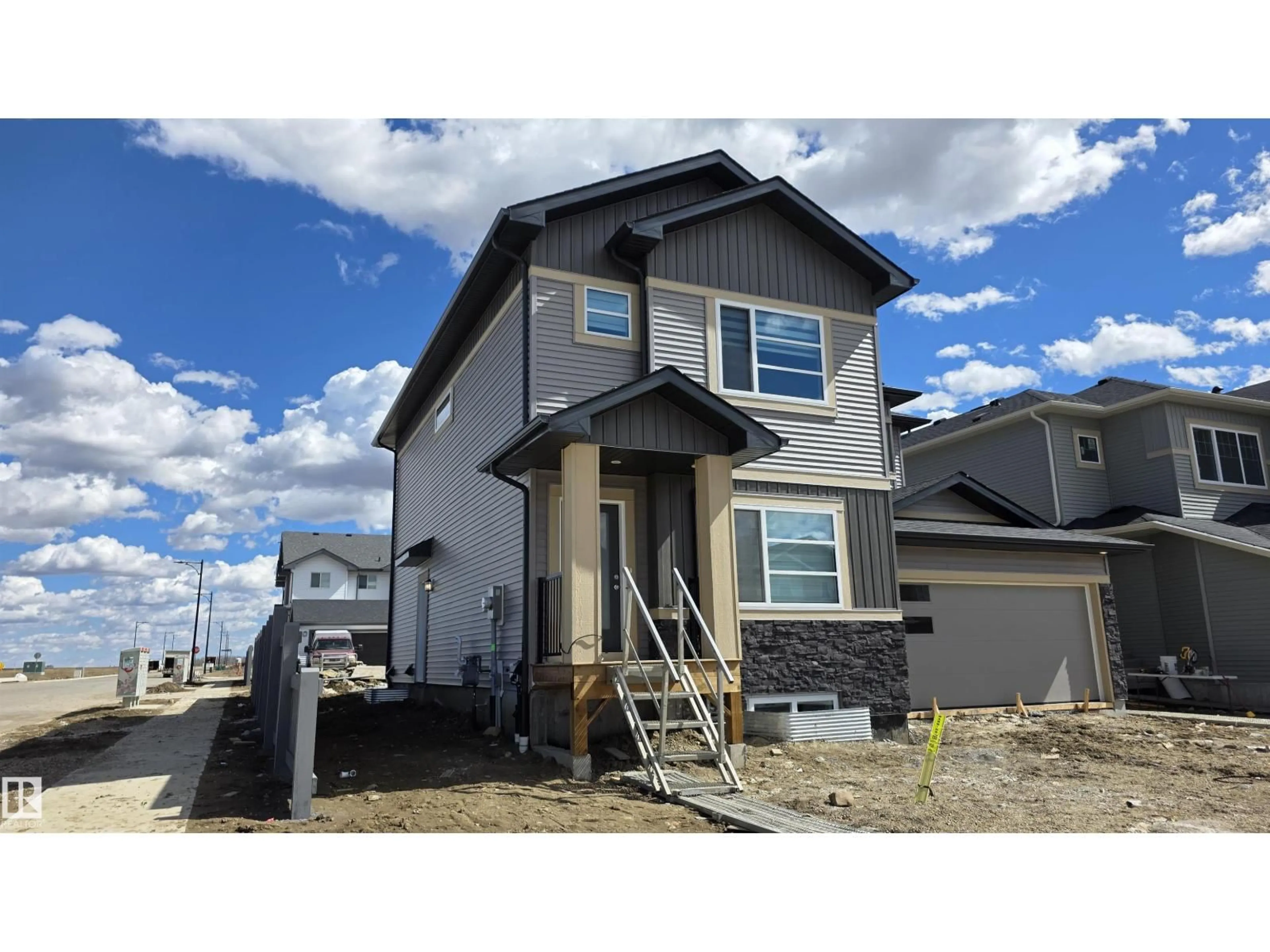 Home with vinyl exterior material, street for 301 BRAE WY, Leduc Alberta T9E1T7