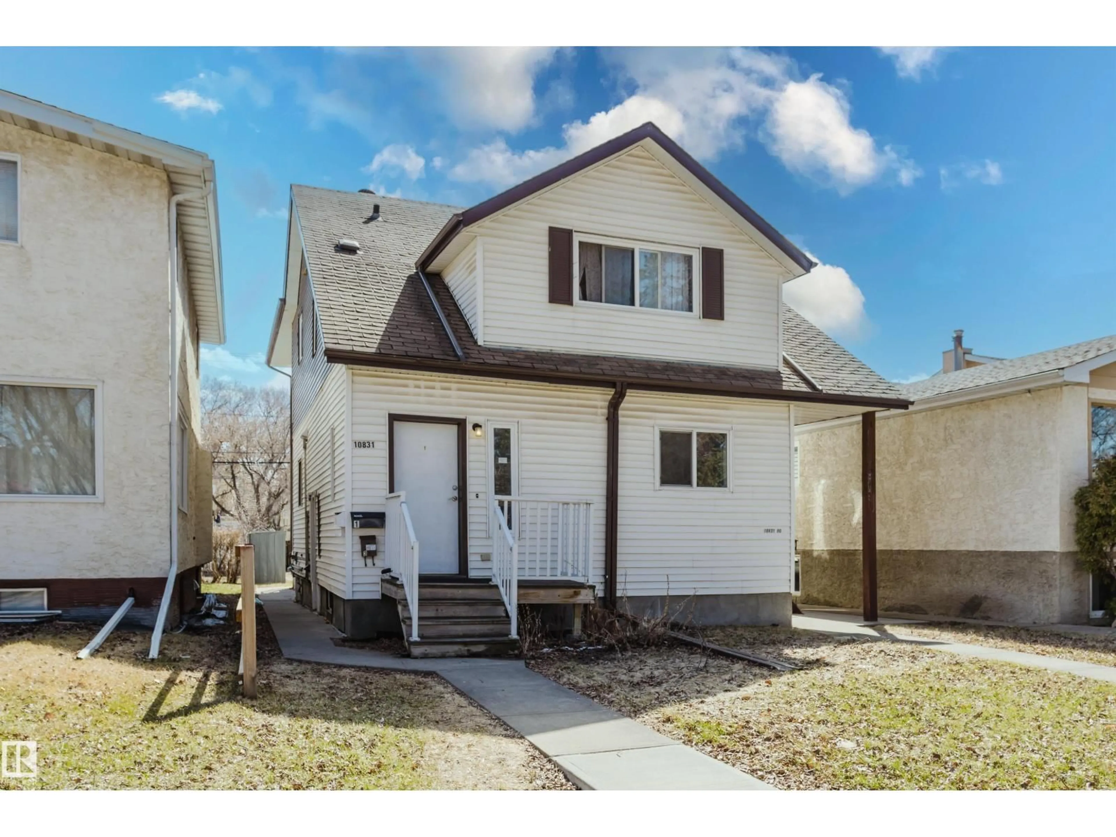 Home with vinyl exterior material, street for 10831 80 AV, Edmonton Alberta T6E1V9