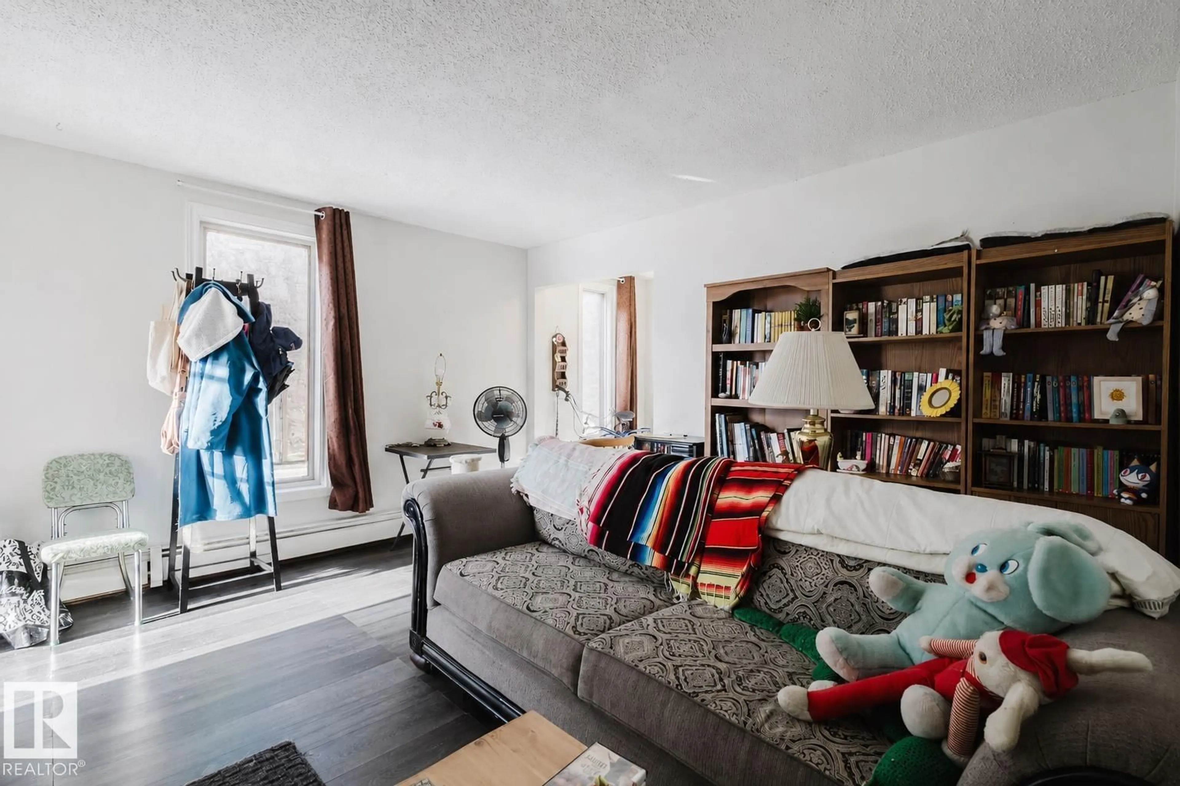 Living room with furniture, unknown for 10831 80 AV, Edmonton Alberta T6E1V9