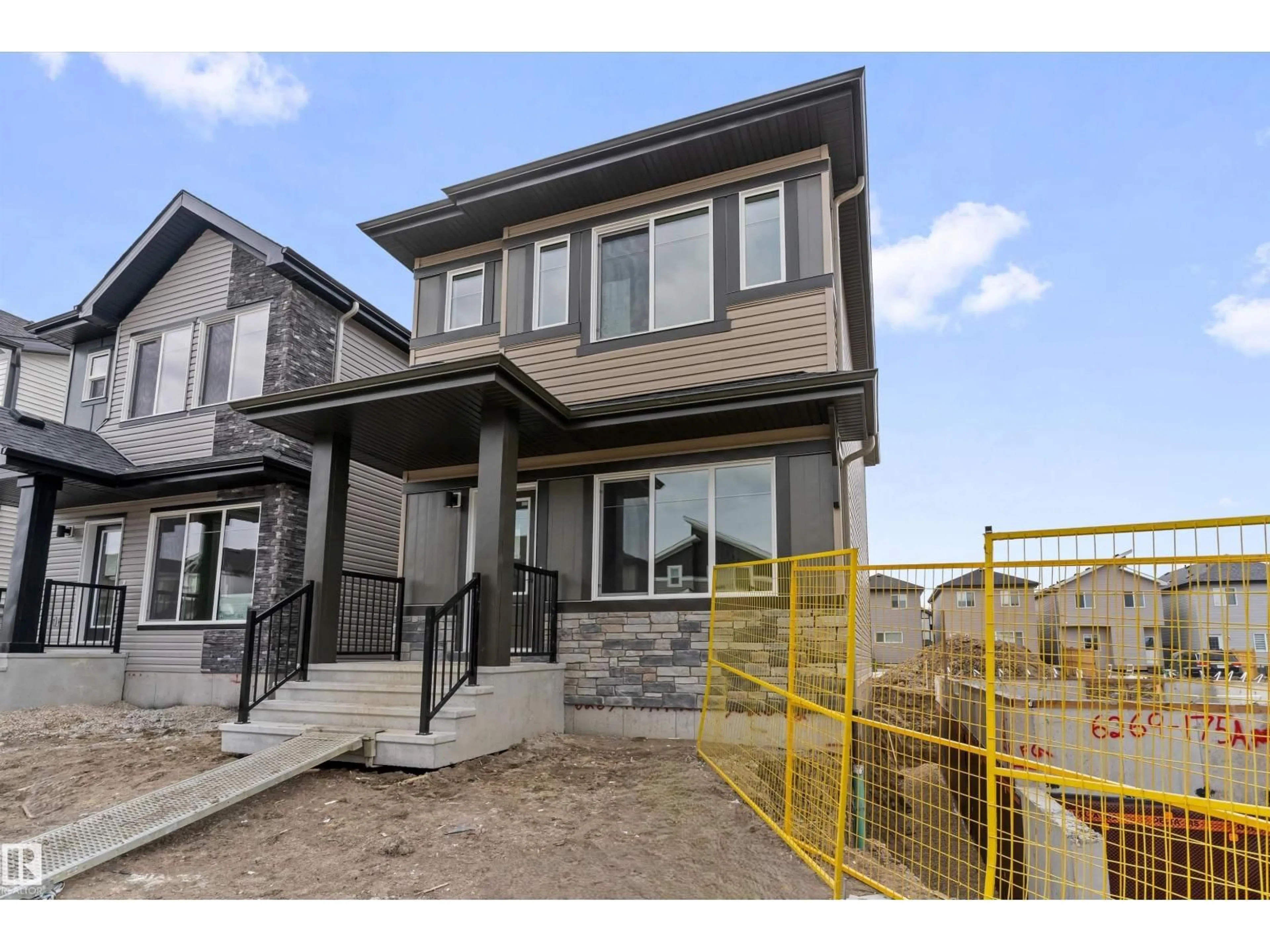 Home with vinyl exterior material, street for 6265 175A AV, Edmonton Alberta T5Y4A5