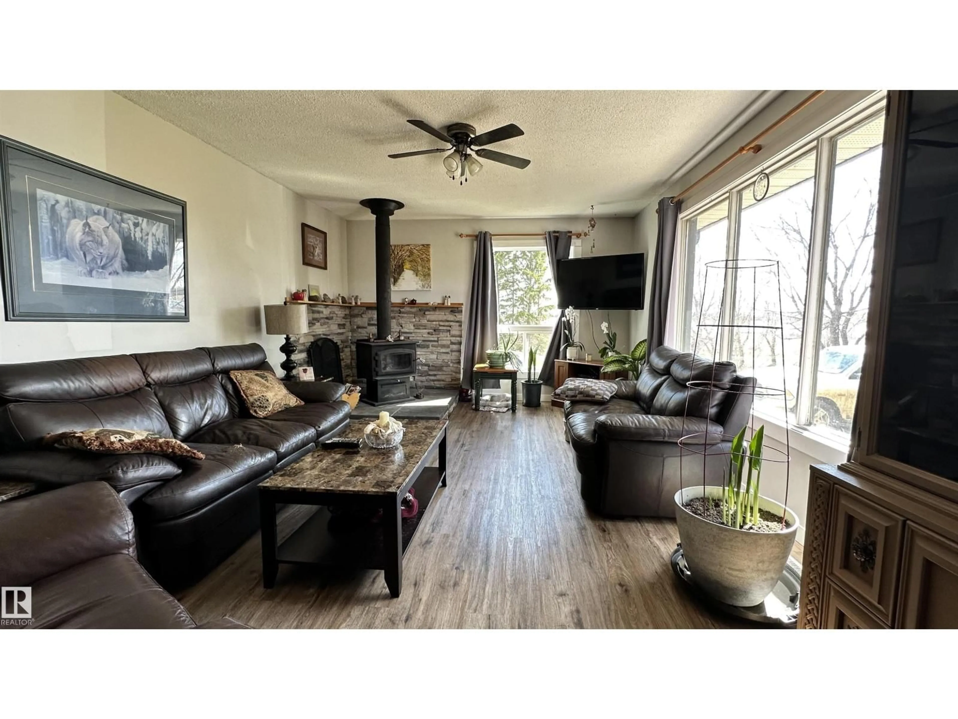 Living room with furniture, wood/laminate floor for 563069 RG RD 181, Rural Lamont County Alberta T0B4B0