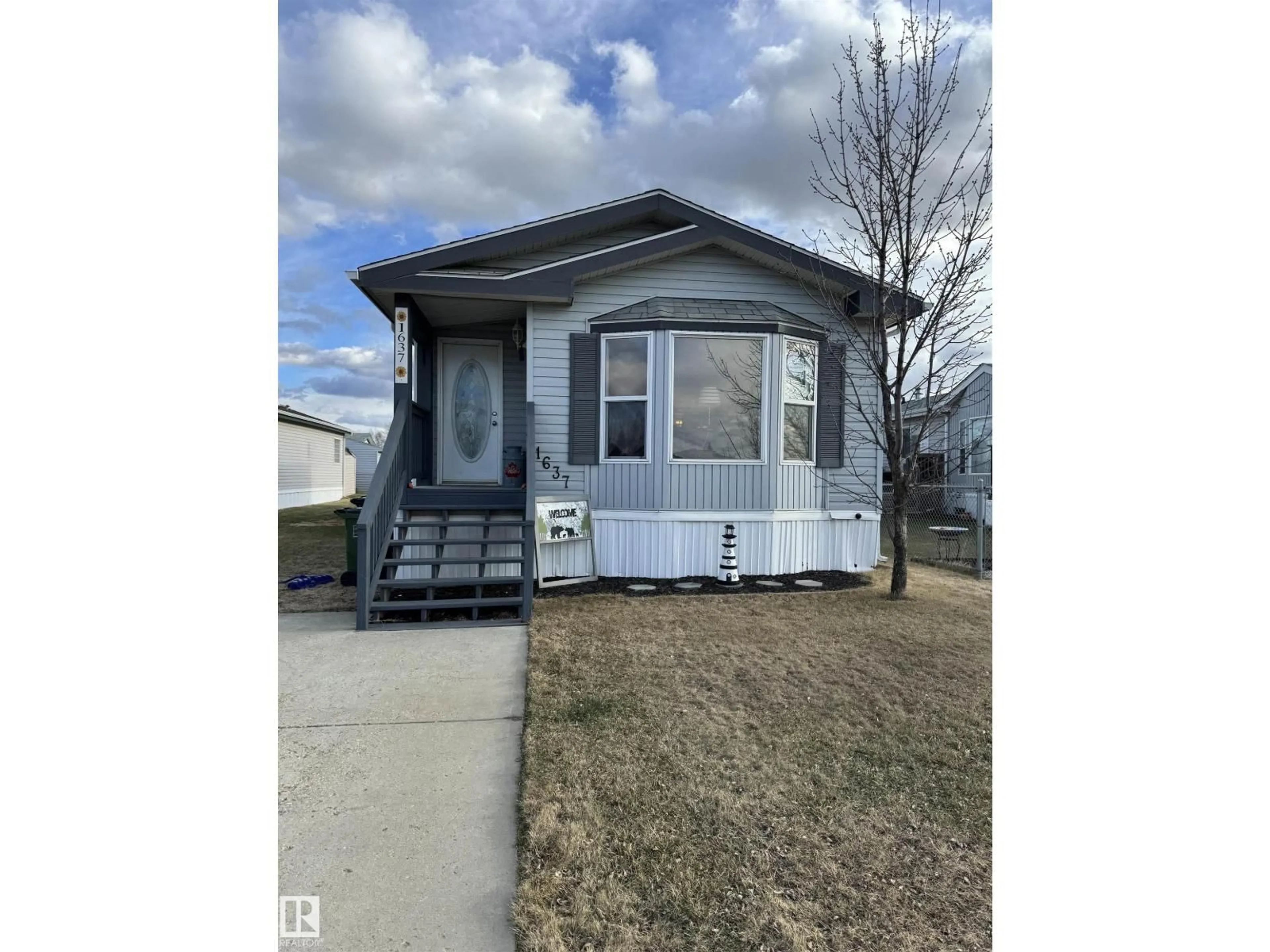 Home with vinyl exterior material, street for 1637 68 AV, Edmonton Alberta T6P0A4