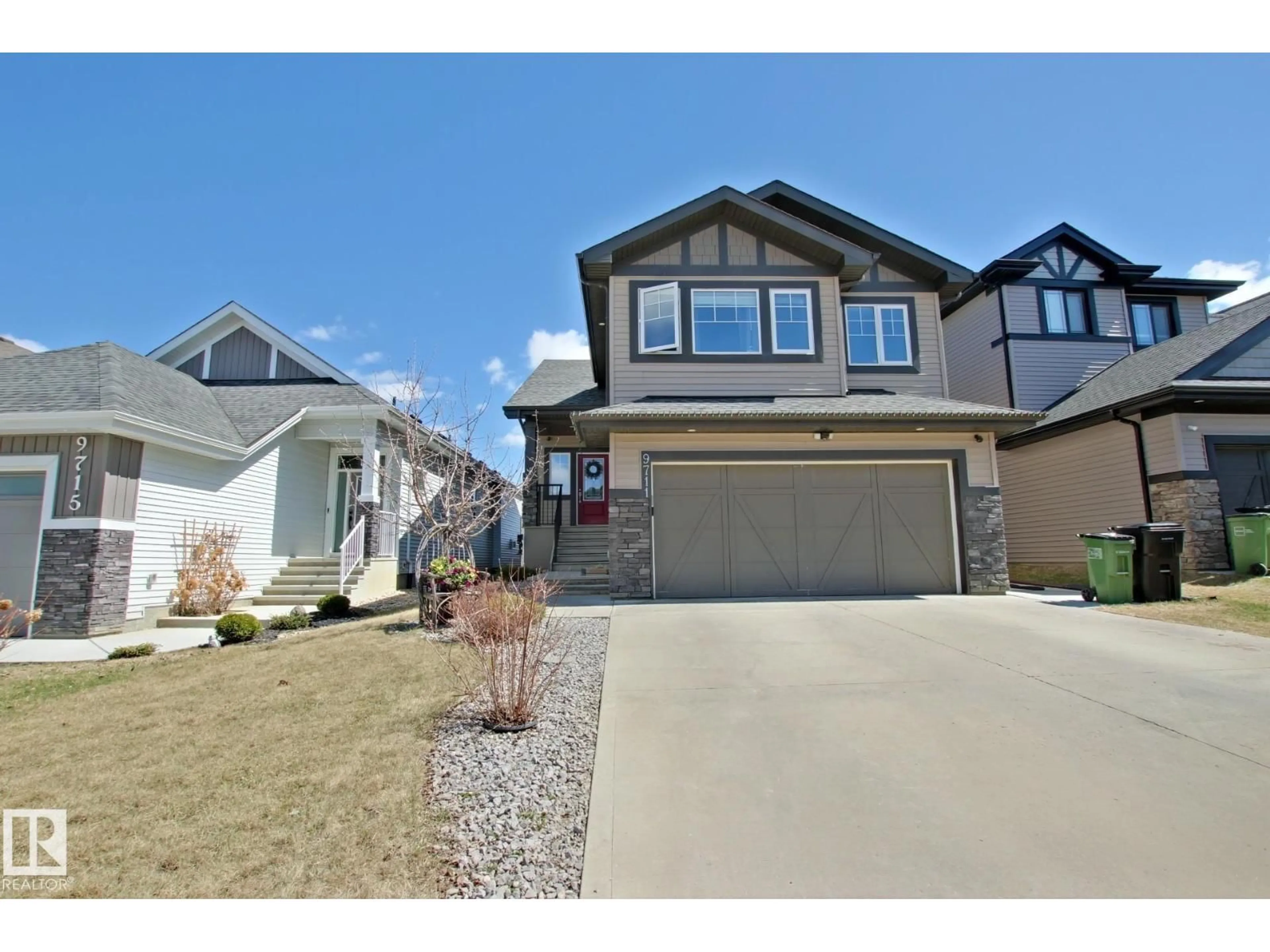 Home with vinyl exterior material, street for NW - 9711 223 ST, Edmonton Alberta T5T4B5