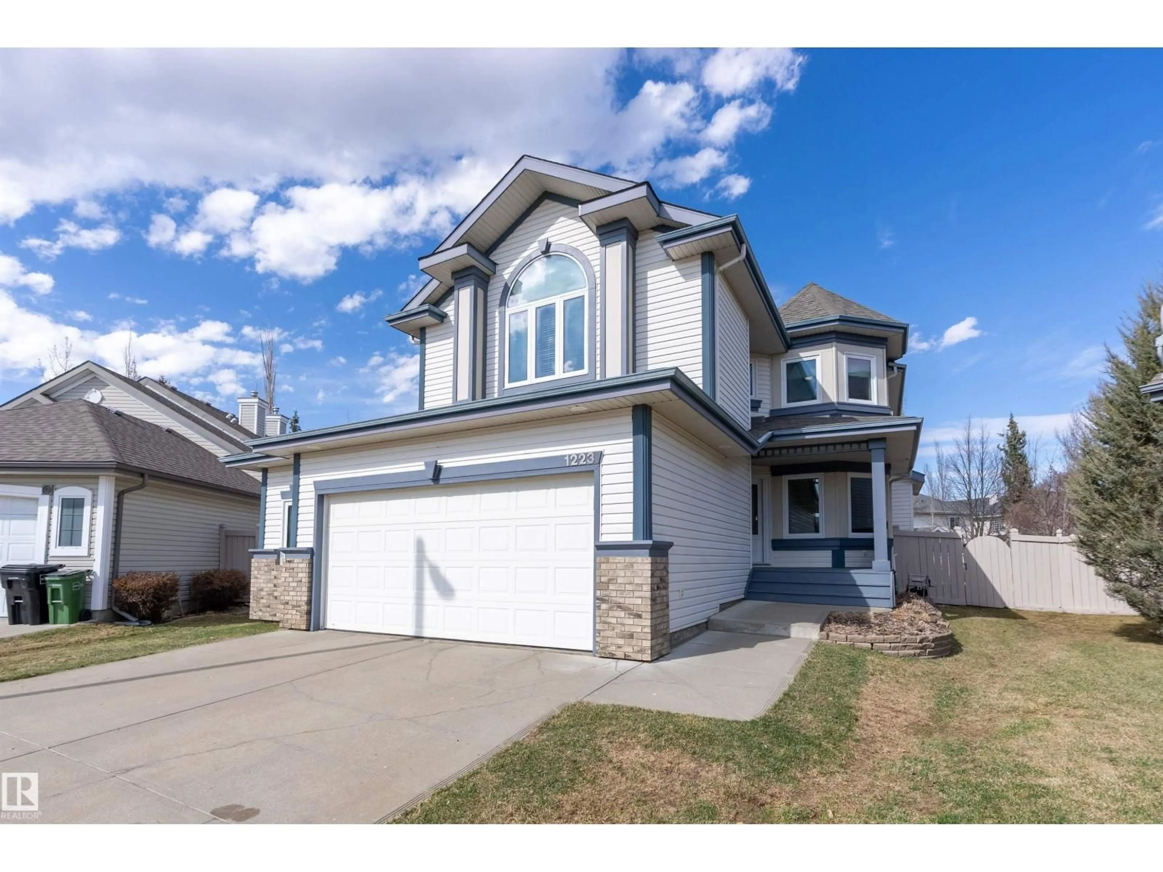 Home with vinyl exterior material, street for NW - 1223 117 ST, Edmonton Alberta T6J7E5