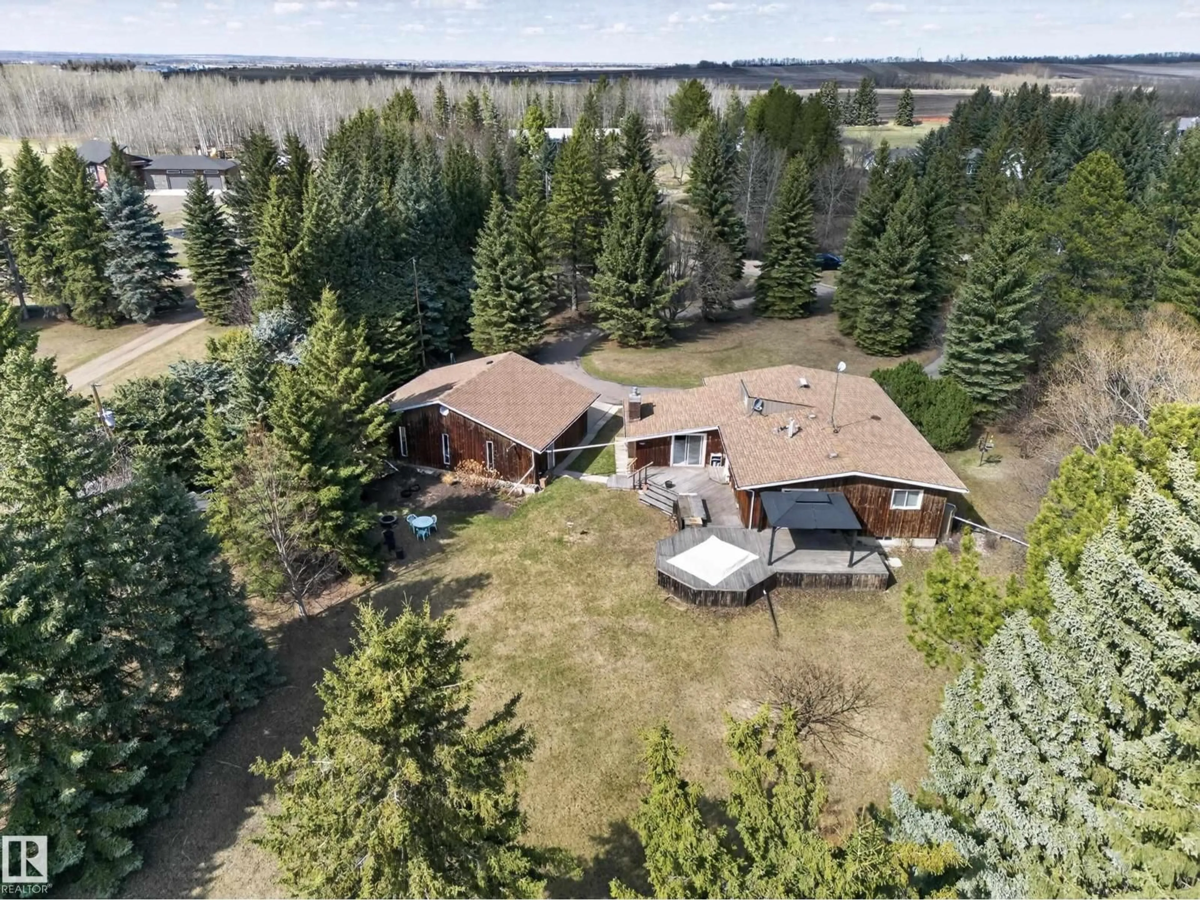 A pic from outside/outdoor area/front of a property/back of a property/a pic from drone, forest/trees view for 53279 - 109 RGE ROAD 225, Rural Strathcona County Alberta T8A4V1