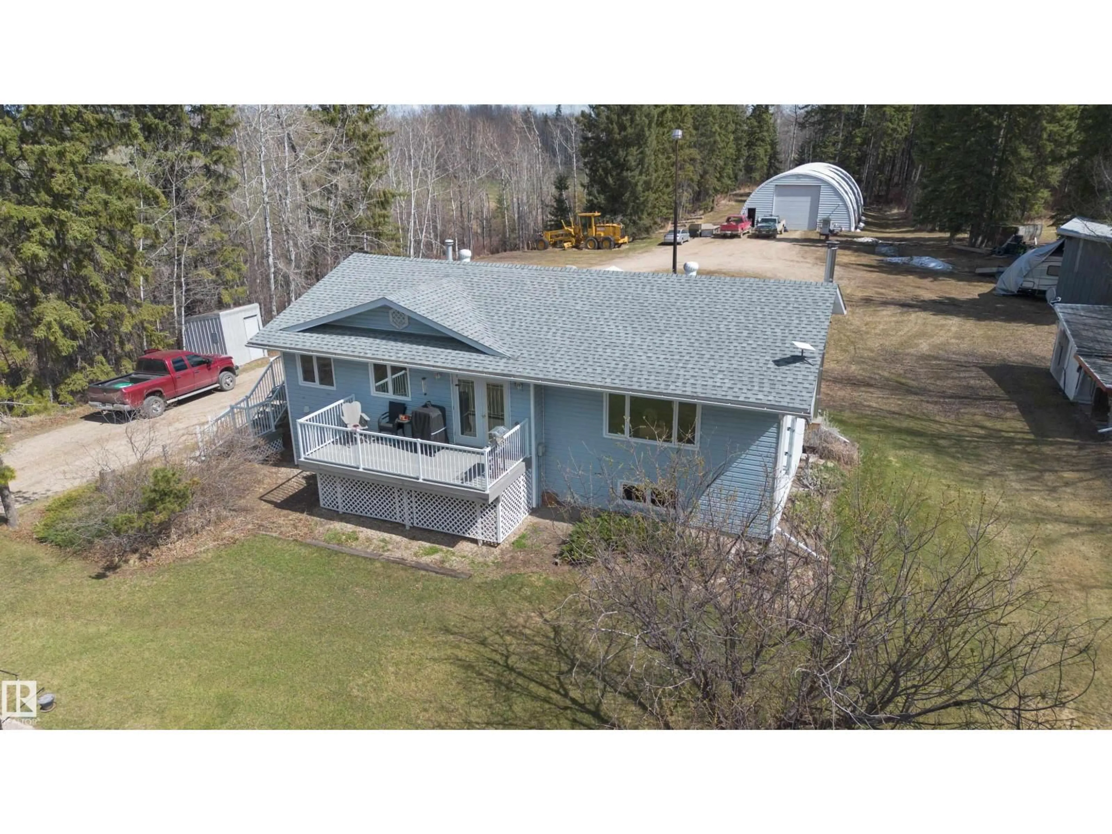 A pic from outside/outdoor area/front of a property/back of a property/a pic from drone, unknown for 57403 HWY 764, Rural Barrhead County Alberta T7N1N4