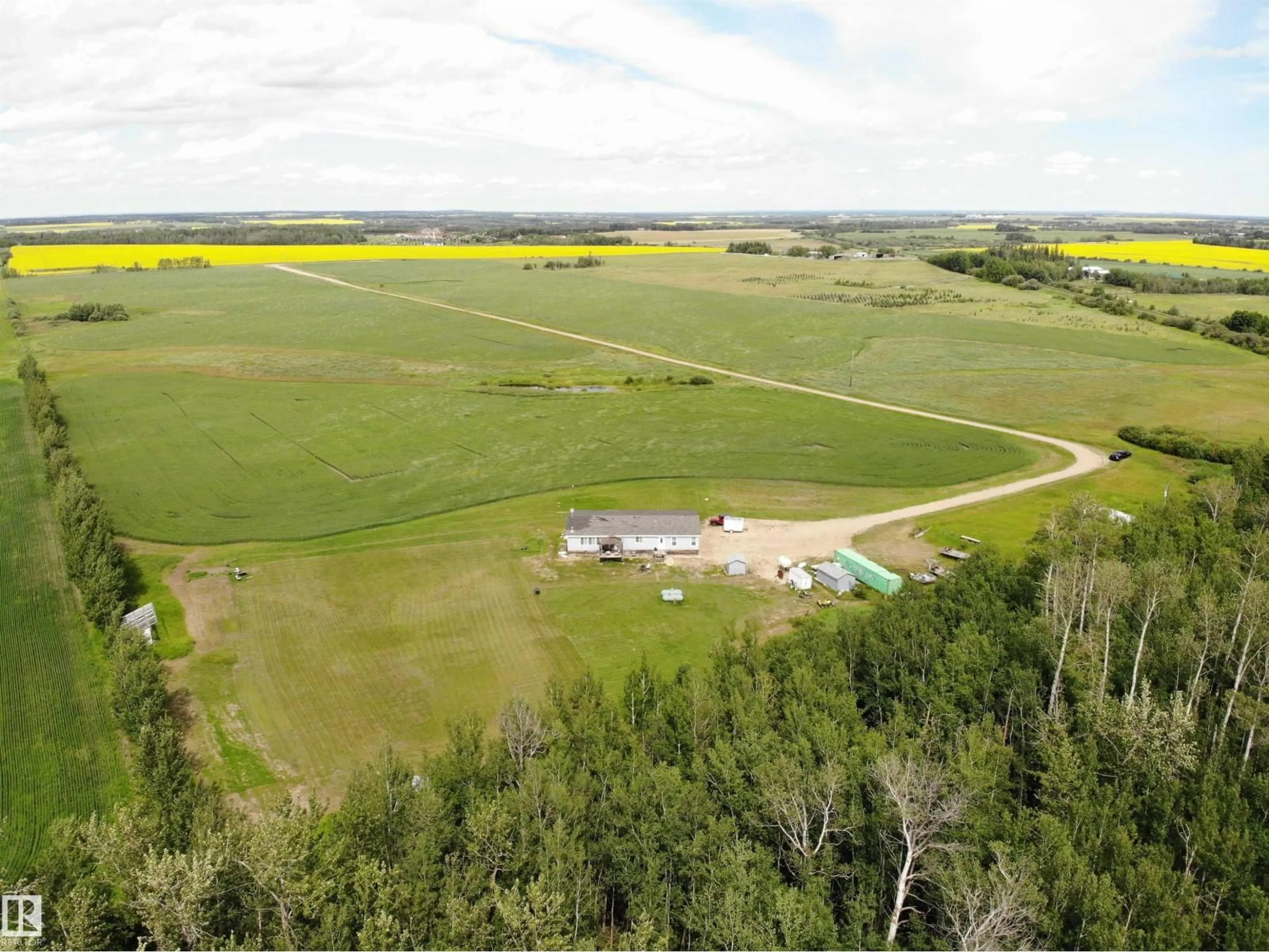 A pic from outside/outdoor area/front of a property/back of a property/a pic from drone, unknown for 27011 TWP RD 580, Rural Westlock County Alberta T0G0A6