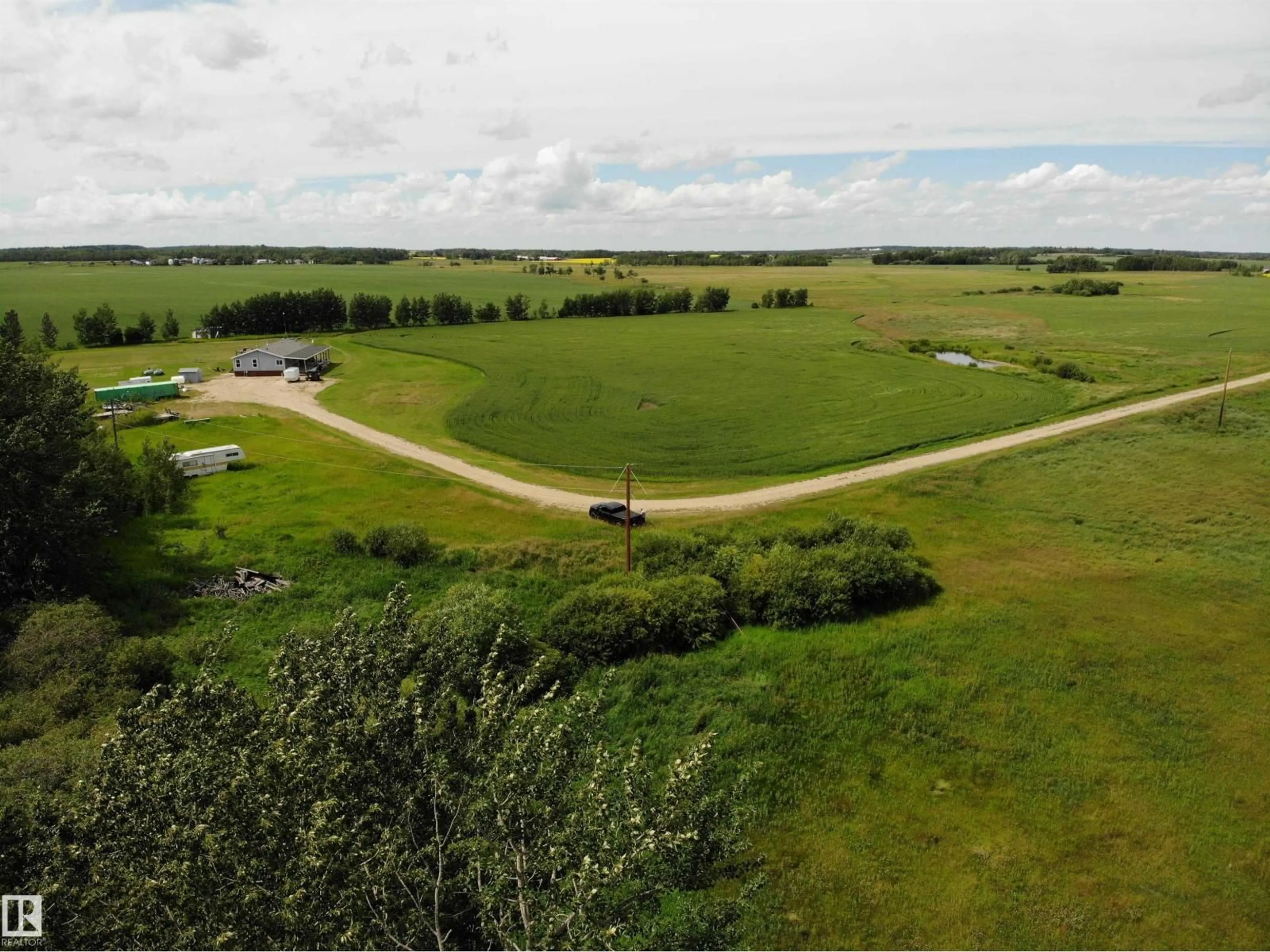 A pic from outside/outdoor area/front of a property/back of a property/a pic from drone, unknown for 27011 TWP RD 580, Rural Westlock County Alberta T0G0A6