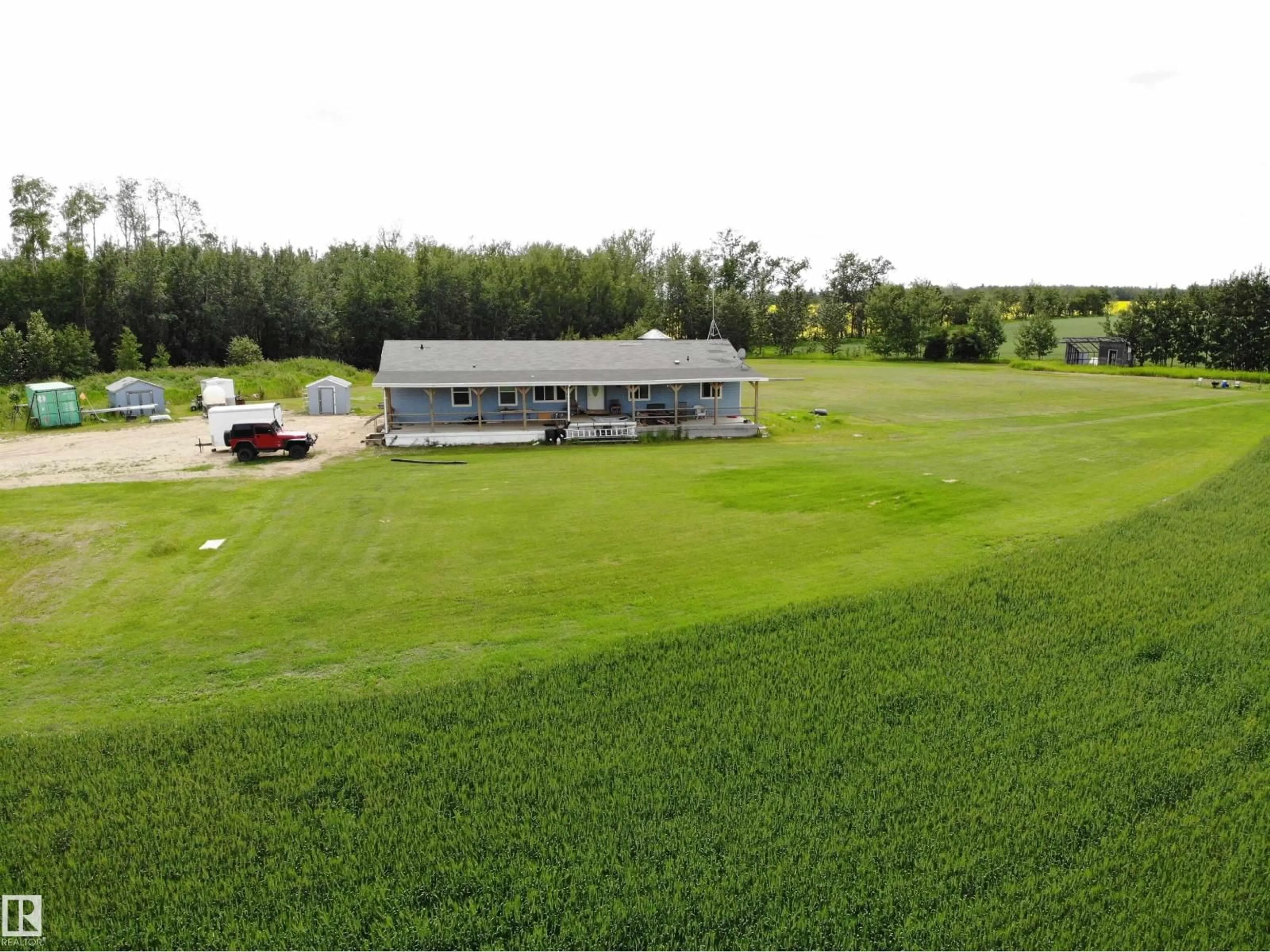 A pic from outside/outdoor area/front of a property/back of a property/a pic from drone, building for 27011 TWP RD 580, Rural Westlock County Alberta T0G0A6