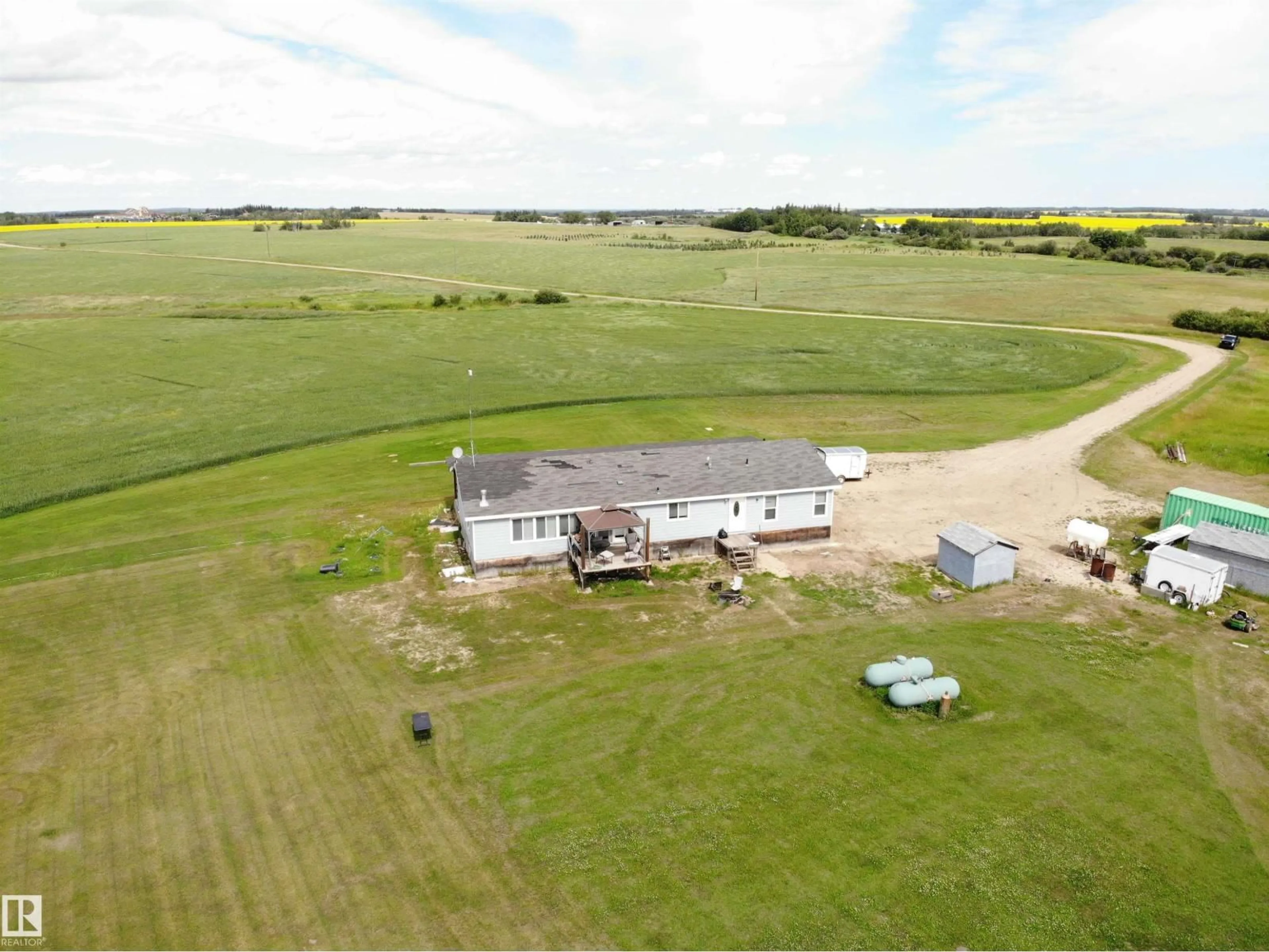 A pic from outside/outdoor area/front of a property/back of a property/a pic from drone, building for 27011 TWP RD 580, Rural Westlock County Alberta T0G0A6